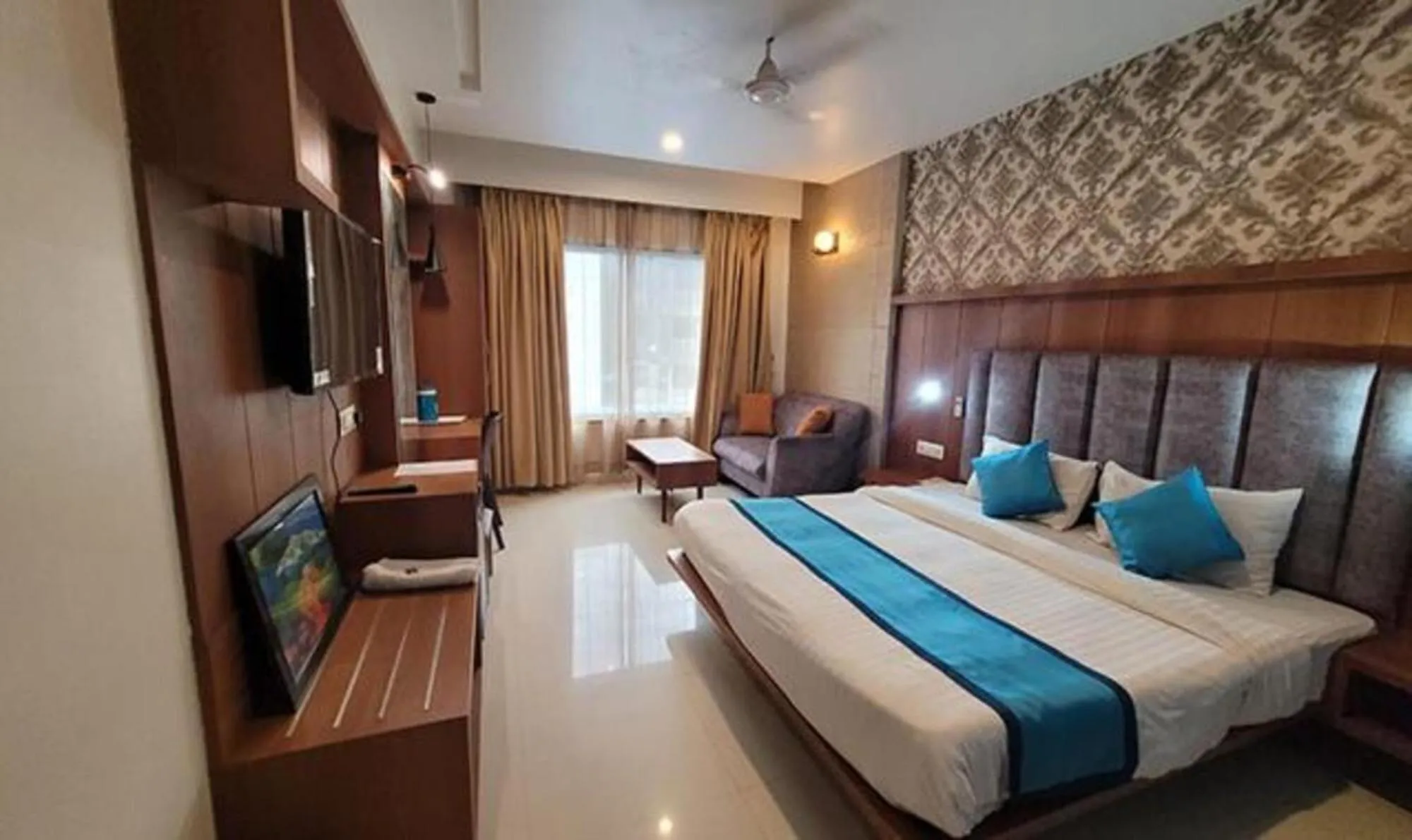 Bed in FabHotel Prime Sapphire Regency