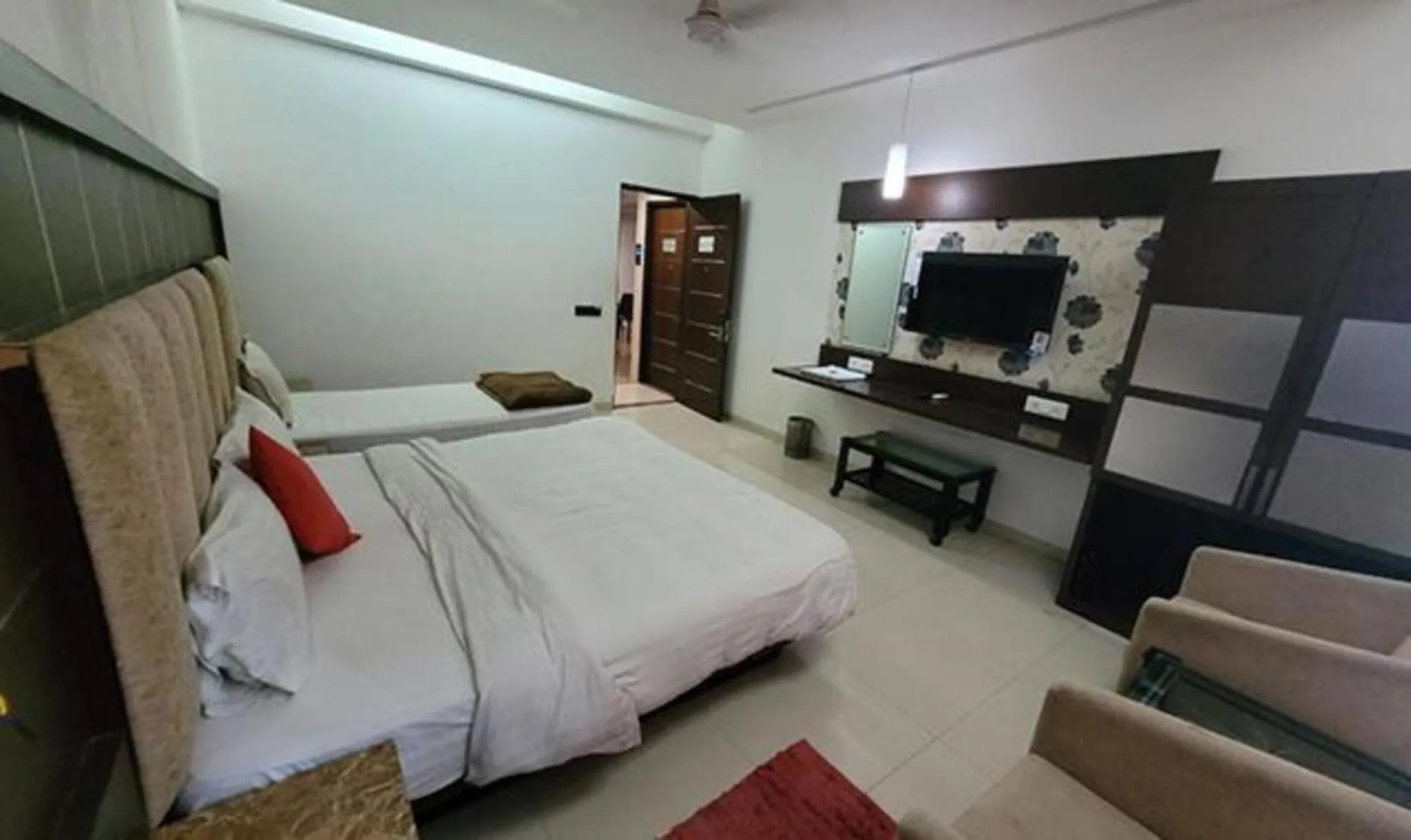 Bed in FabHotel Prime Sapphire Regency