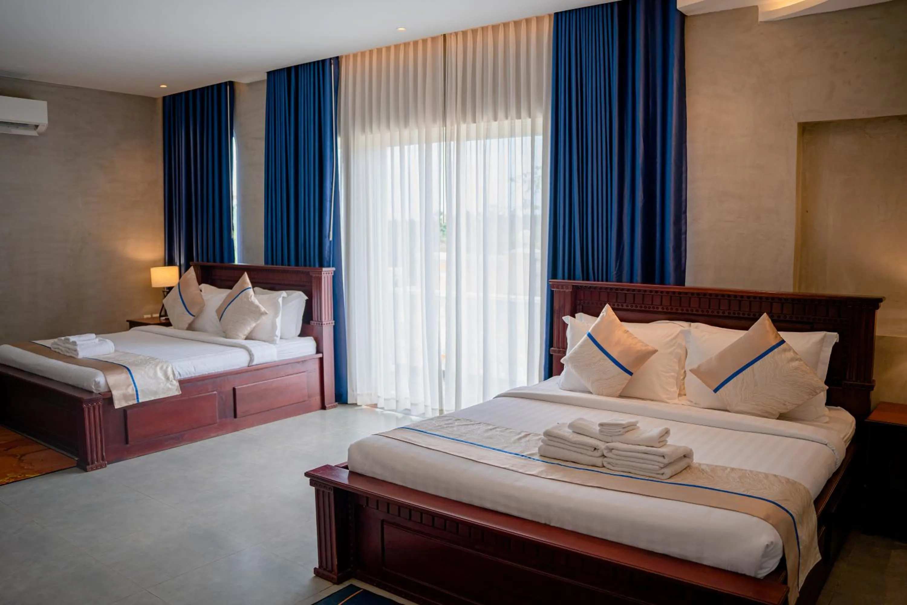 Bed in Sokchea Kampot Hotel