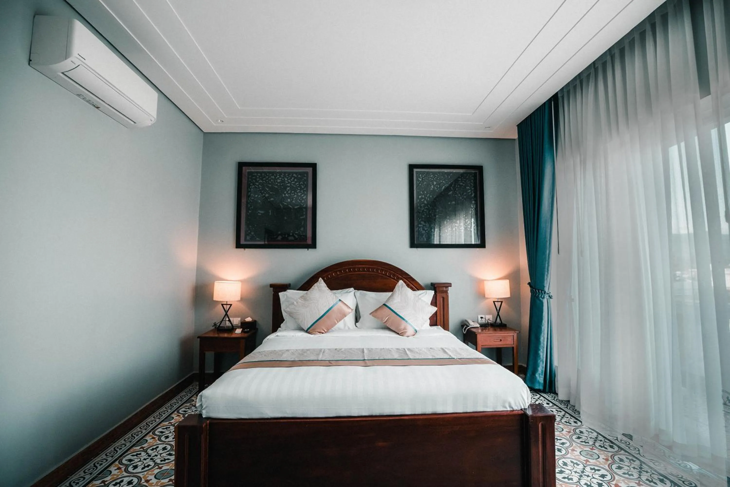 Bed in Sokchea Kampot Hotel