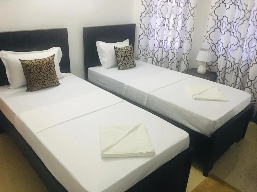 Bed in Kavee Transit Hotel