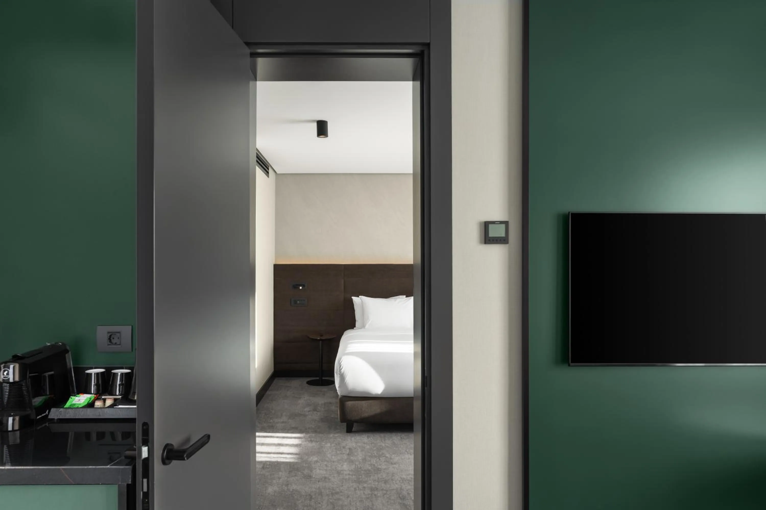 Communal lounge/ TV room, Bed in Novotel Tbilisi Center