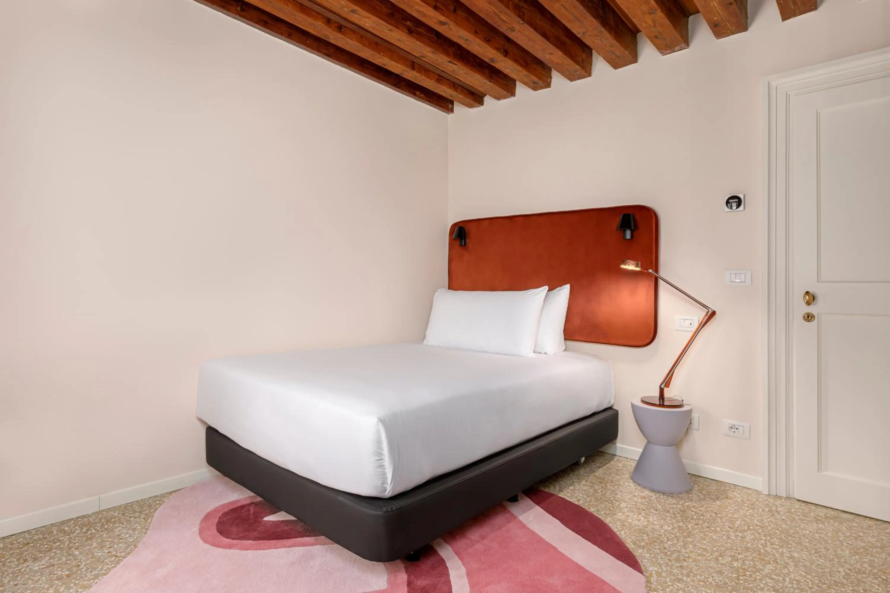 Bed in Palazzo Dei Fiori by Room Mate