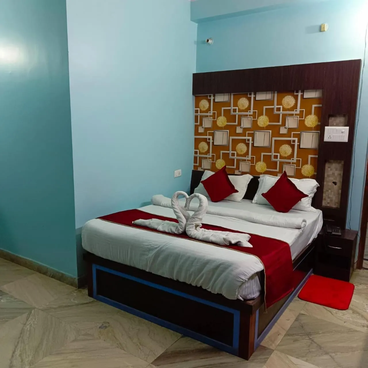 Bed in Hotel Nirmala Inn