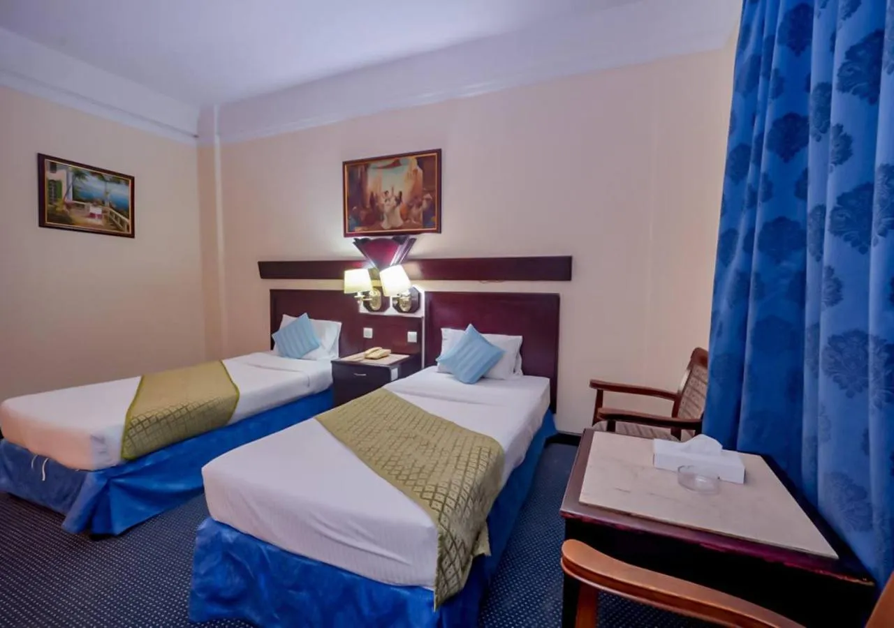 Bed in Claridge Hotel Dubai