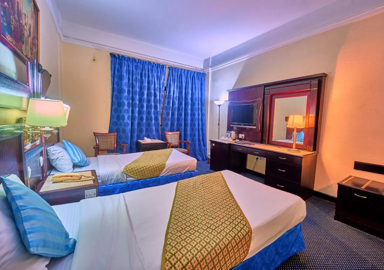 Bed in Claridge Hotel Dubai