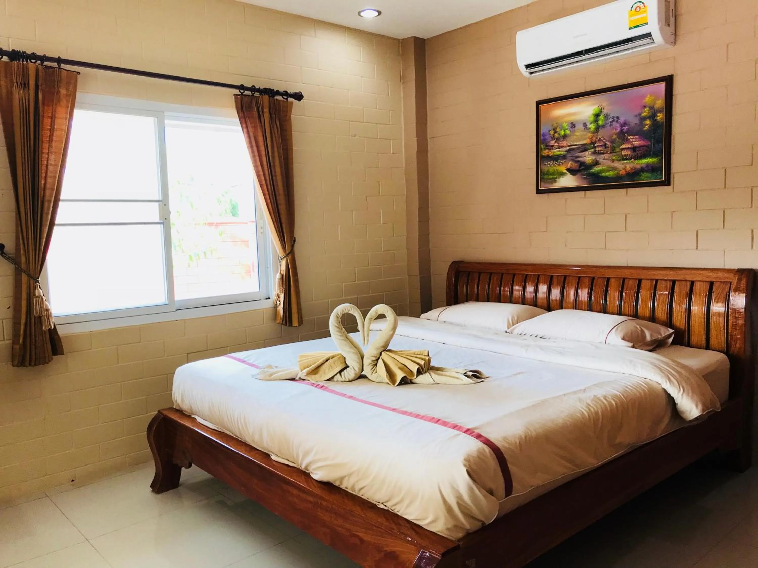Bed in Benwadee Resort Pattaya