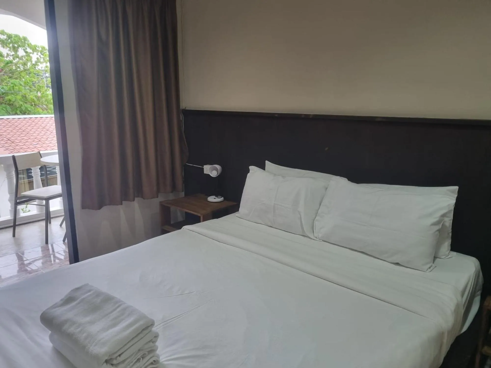 Bed in New Breakers Hotel Rawai