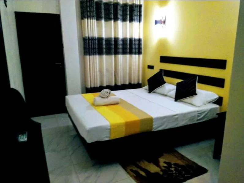 Bed in AMRON RESORT SIGIRIYA