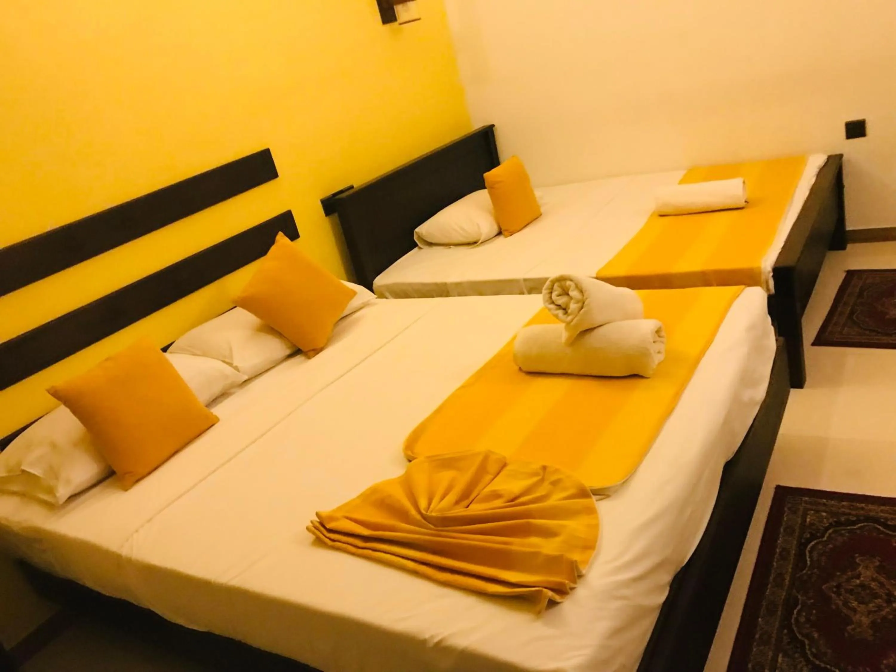Bed in AMRON RESORT SIGIRIYA