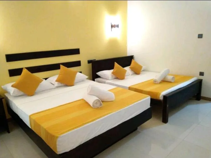 Bed in AMRON RESORT SIGIRIYA