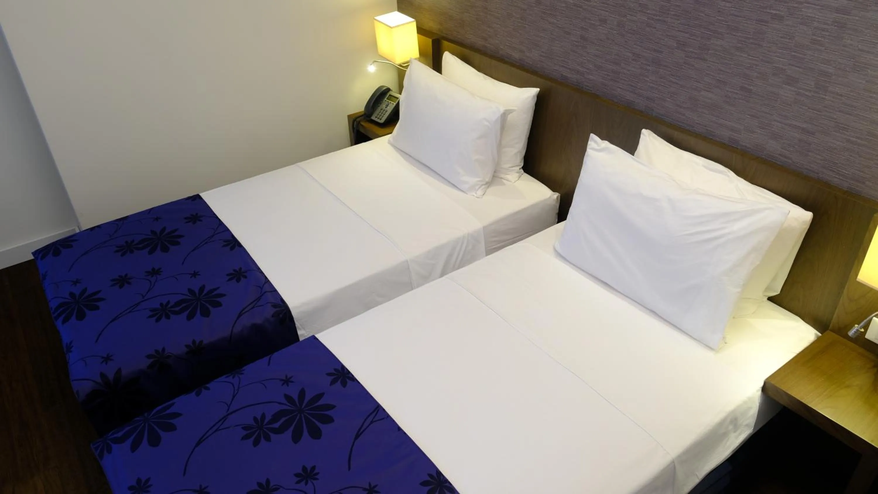 Bed in FEZ INN Hotel