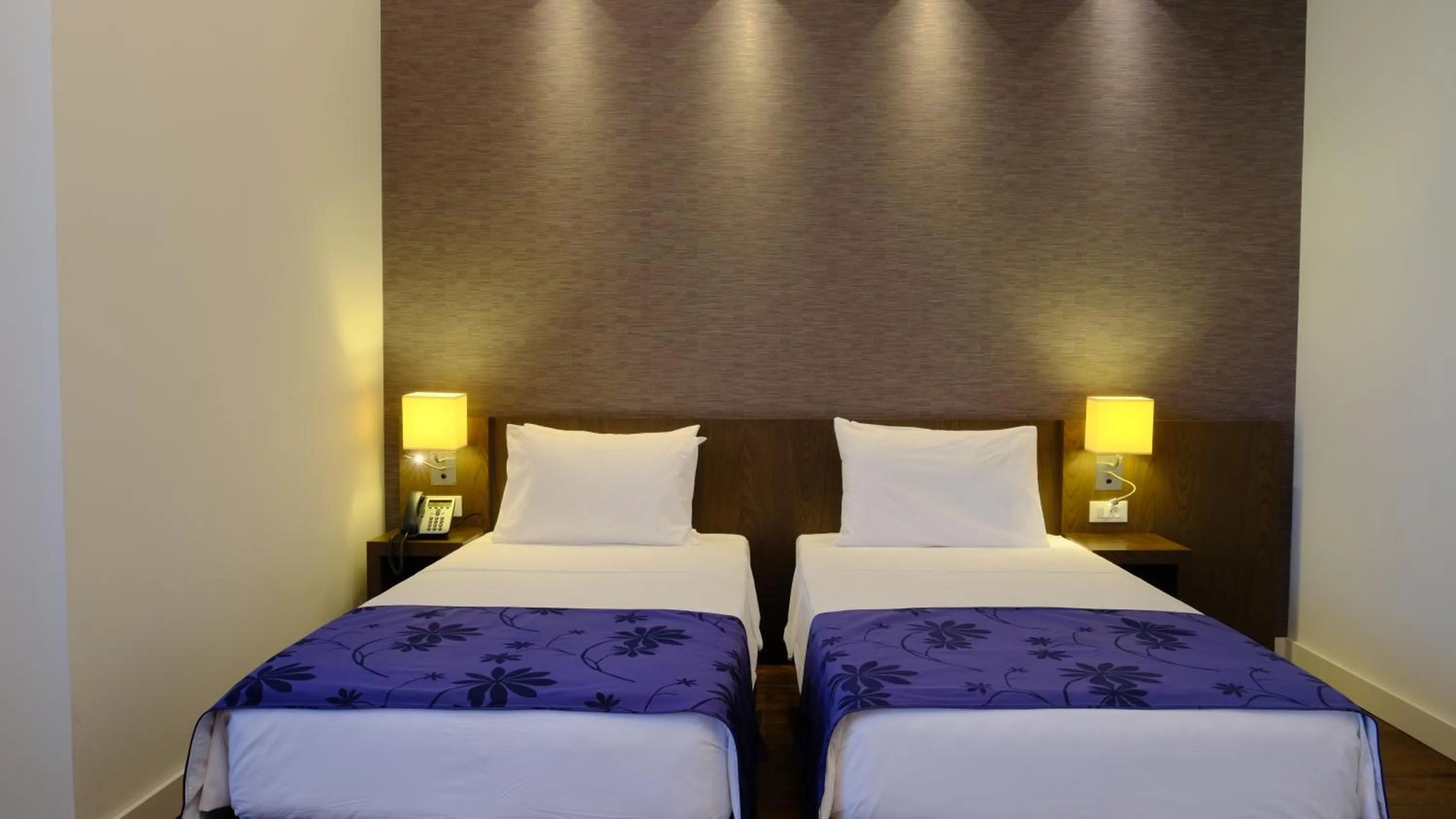 Bed in FEZ INN Hotel