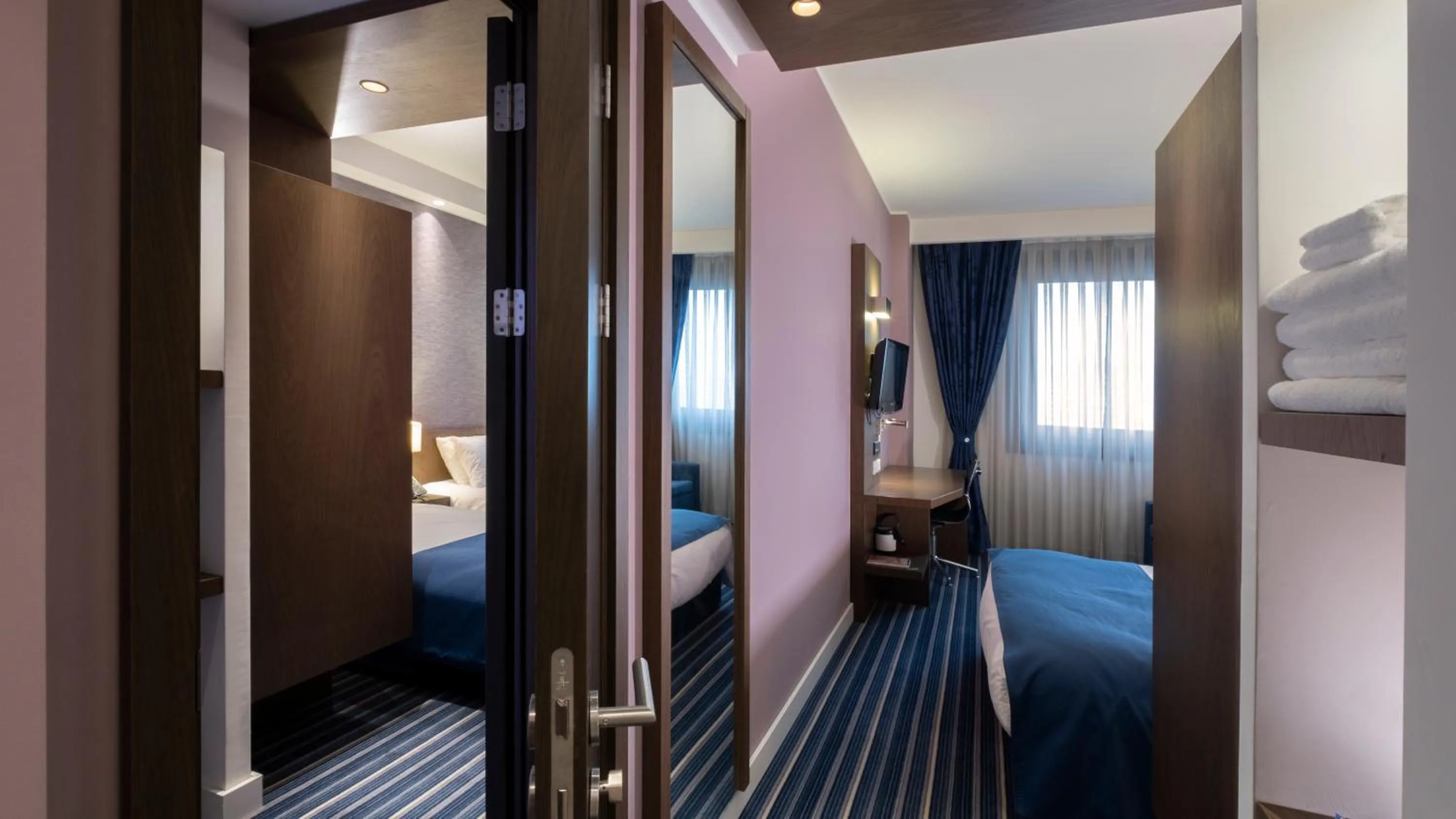 Bed in FEZ INN Hotel