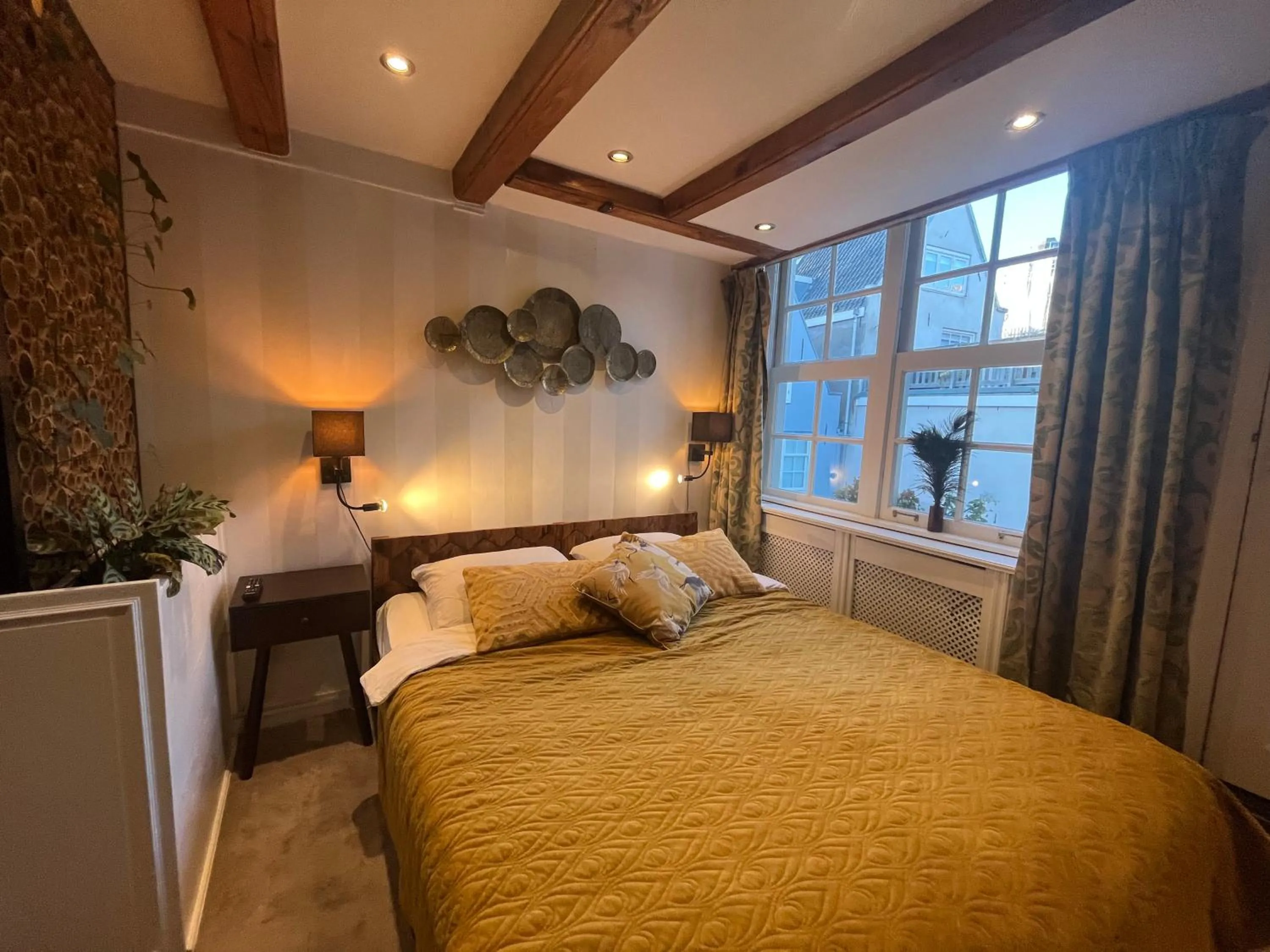 Bed in The Enlightened House Luxury Suites