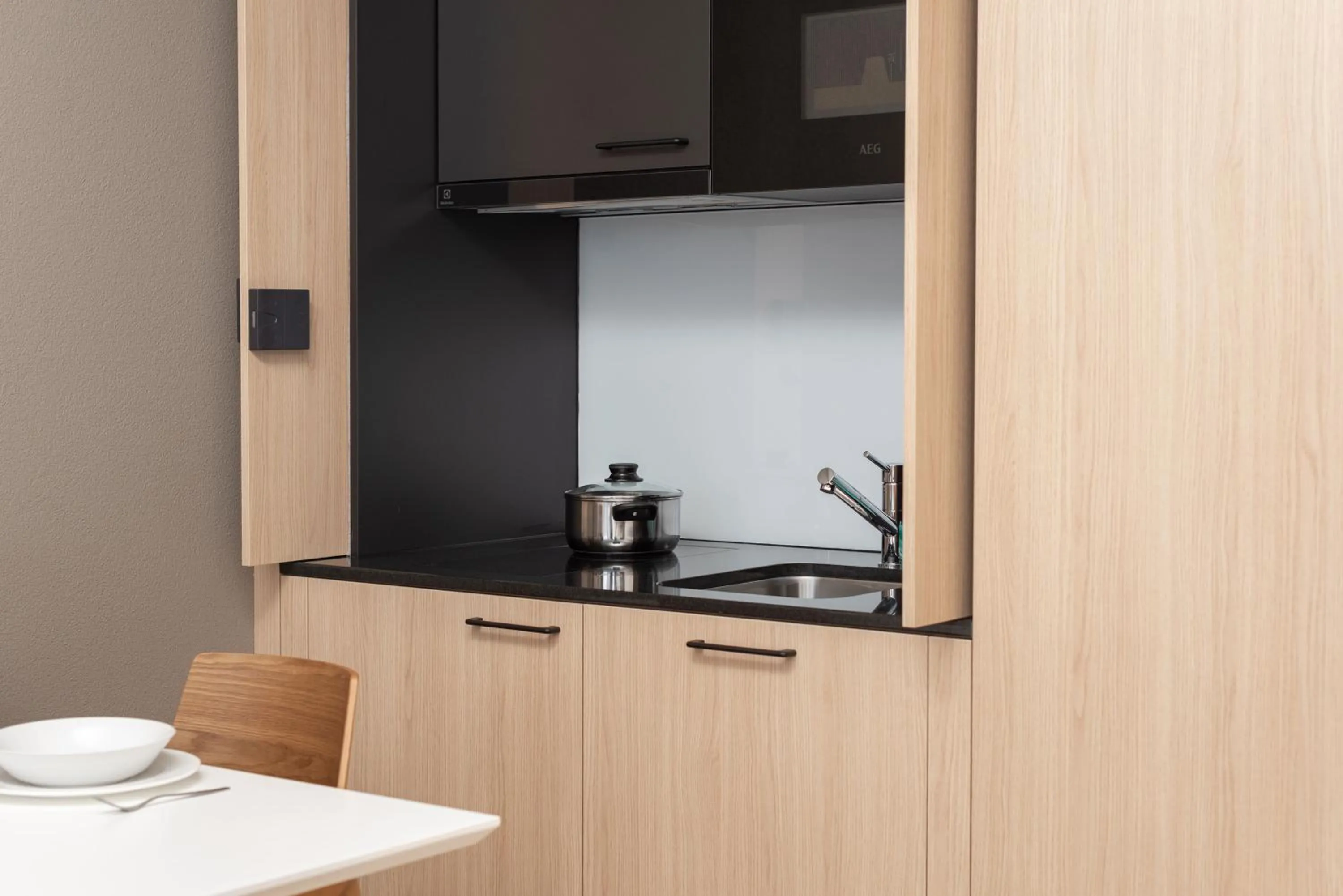 Kitchen or kitchenette in Tailormade Hotel BAB Bachenbülach