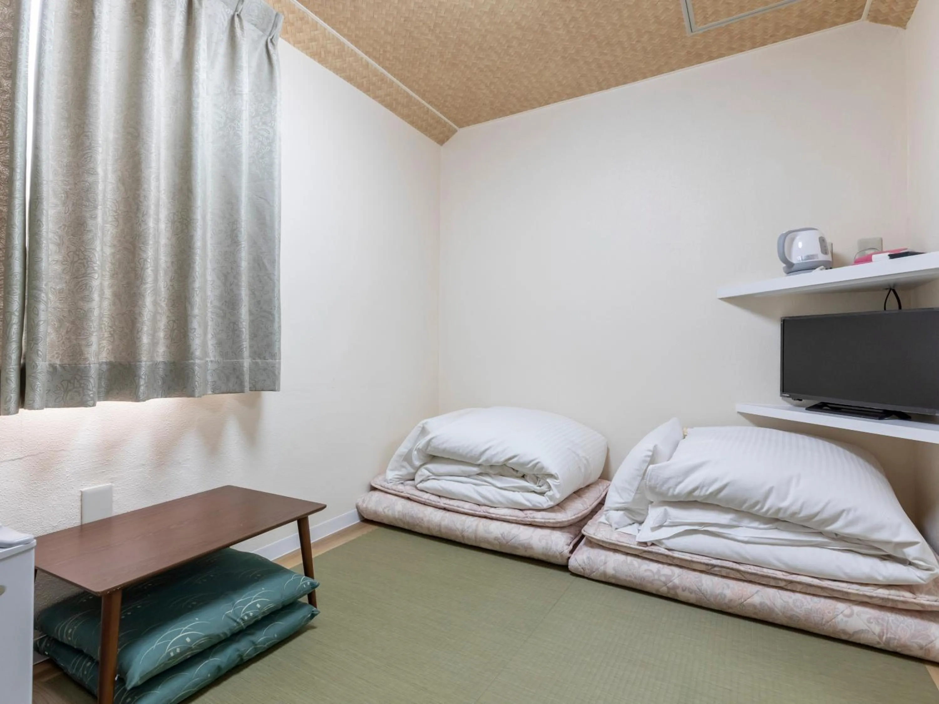 Photo of the whole room, Bed in Tabist New Gekkoen