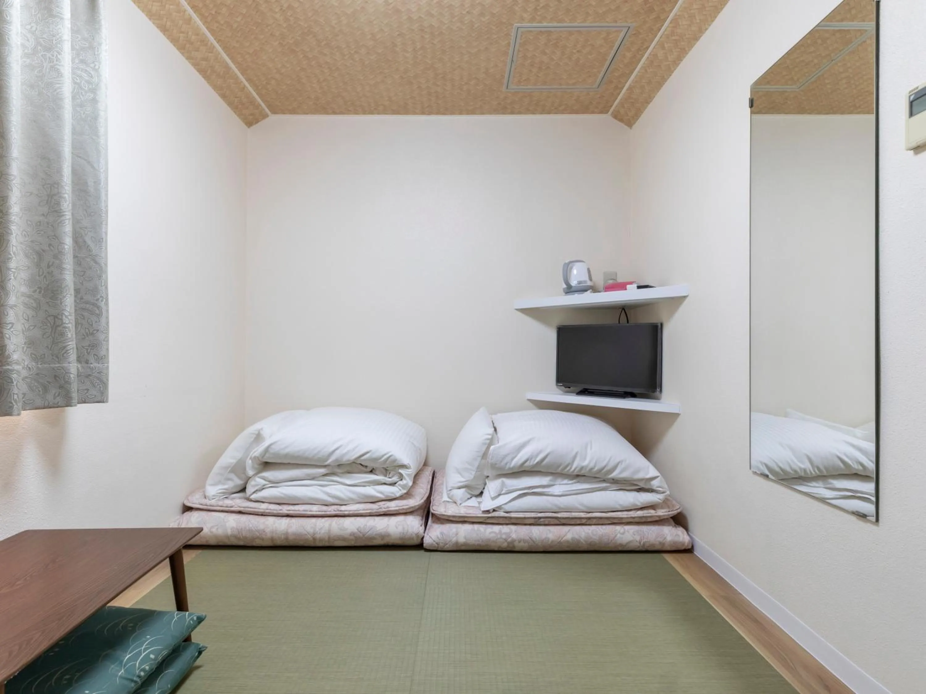 Photo of the whole room, Bed in Tabist New Gekkoen