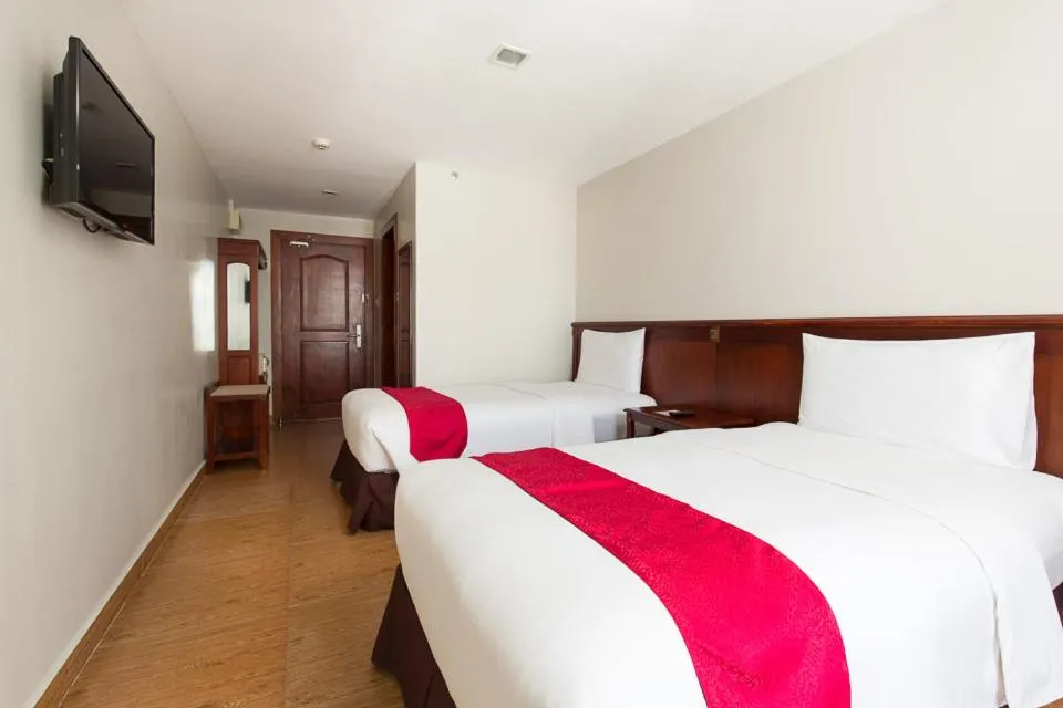 Bed in MJ Hotel and Suites