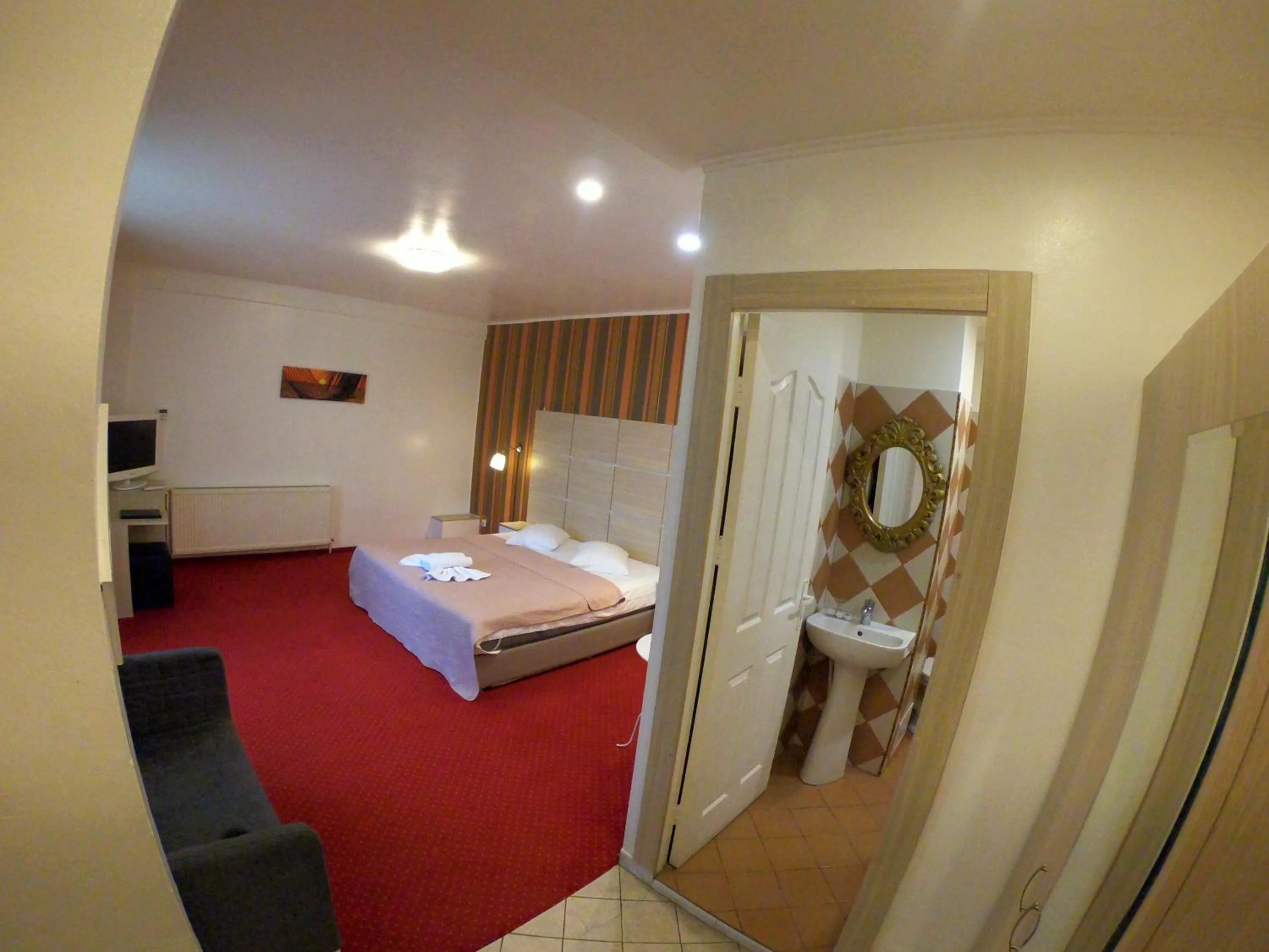 Bed in Hotel Mon Caprice