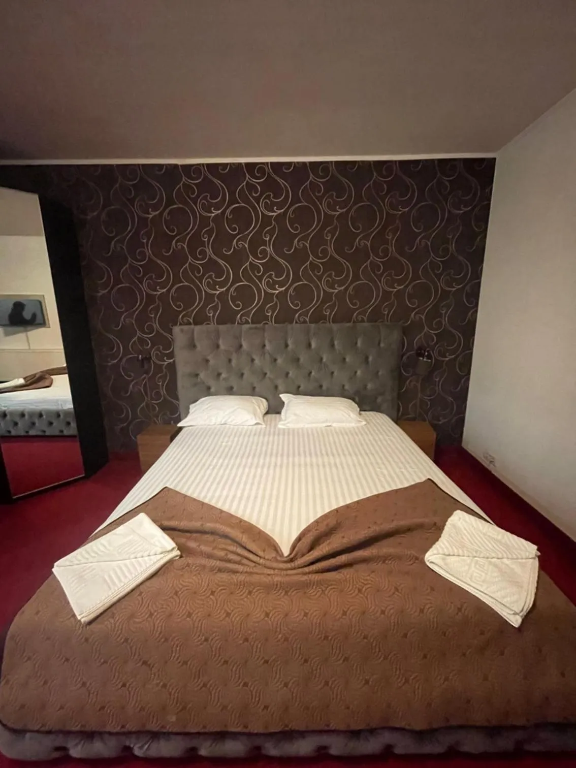 Bed in Hotel Mon Caprice