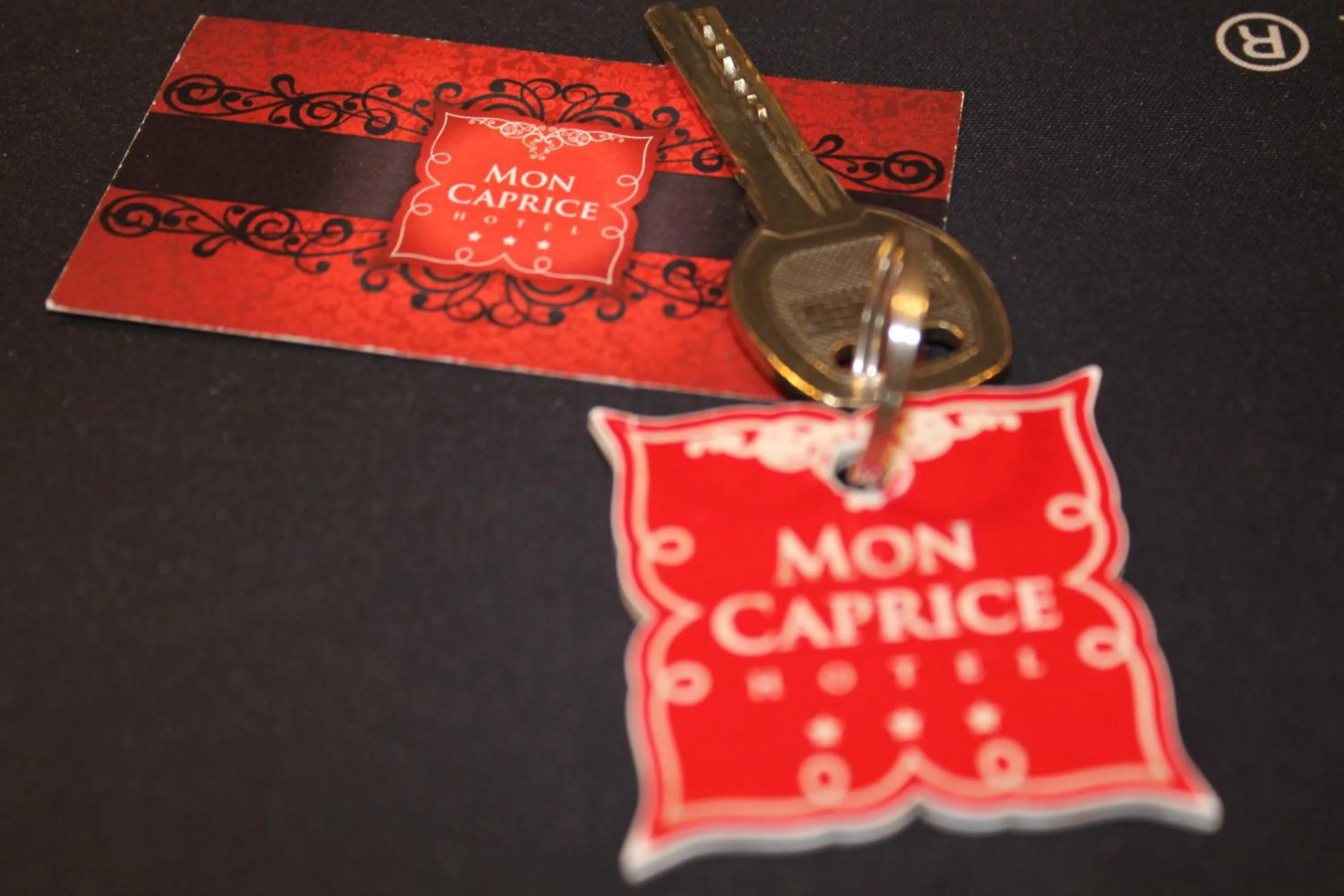 Property logo or sign in Hotel Mon Caprice