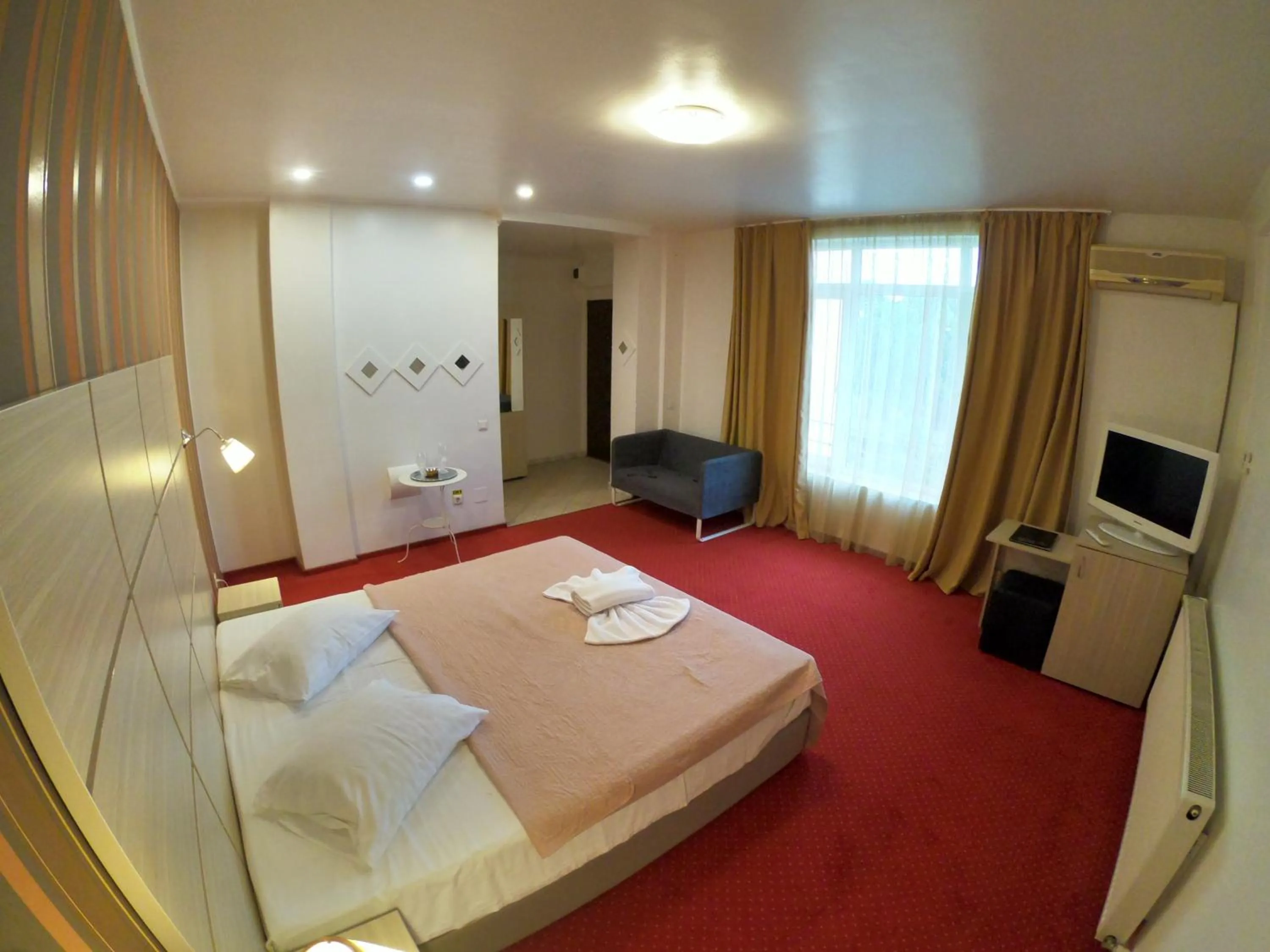 Bed in Hotel Mon Caprice