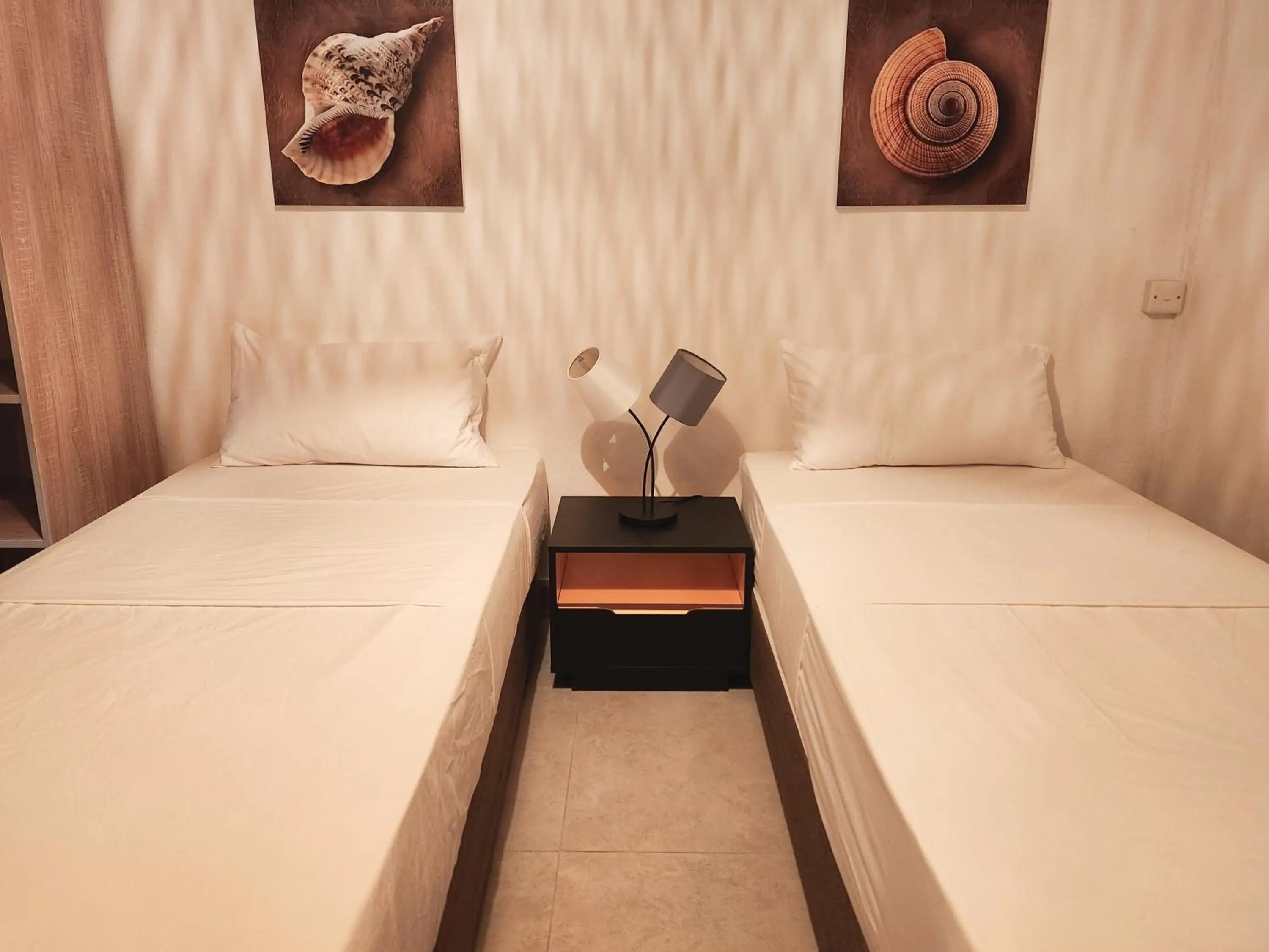 Bed in La Perla Holiday Apartments