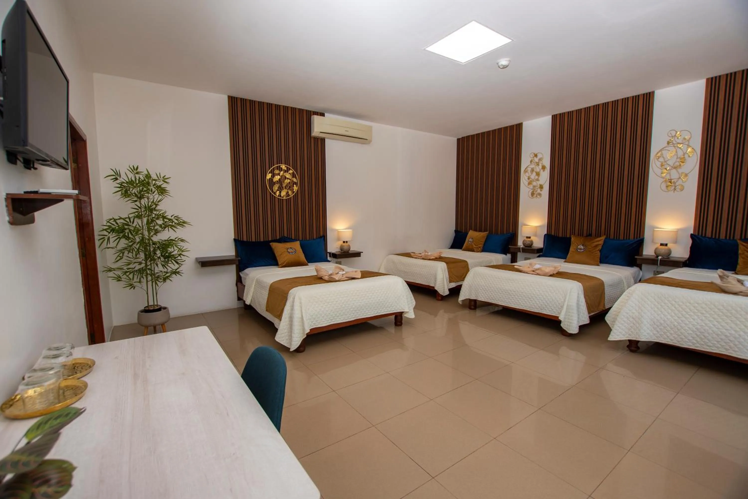 Bed in Blue Marlin Galápagos, Hotel & SPA