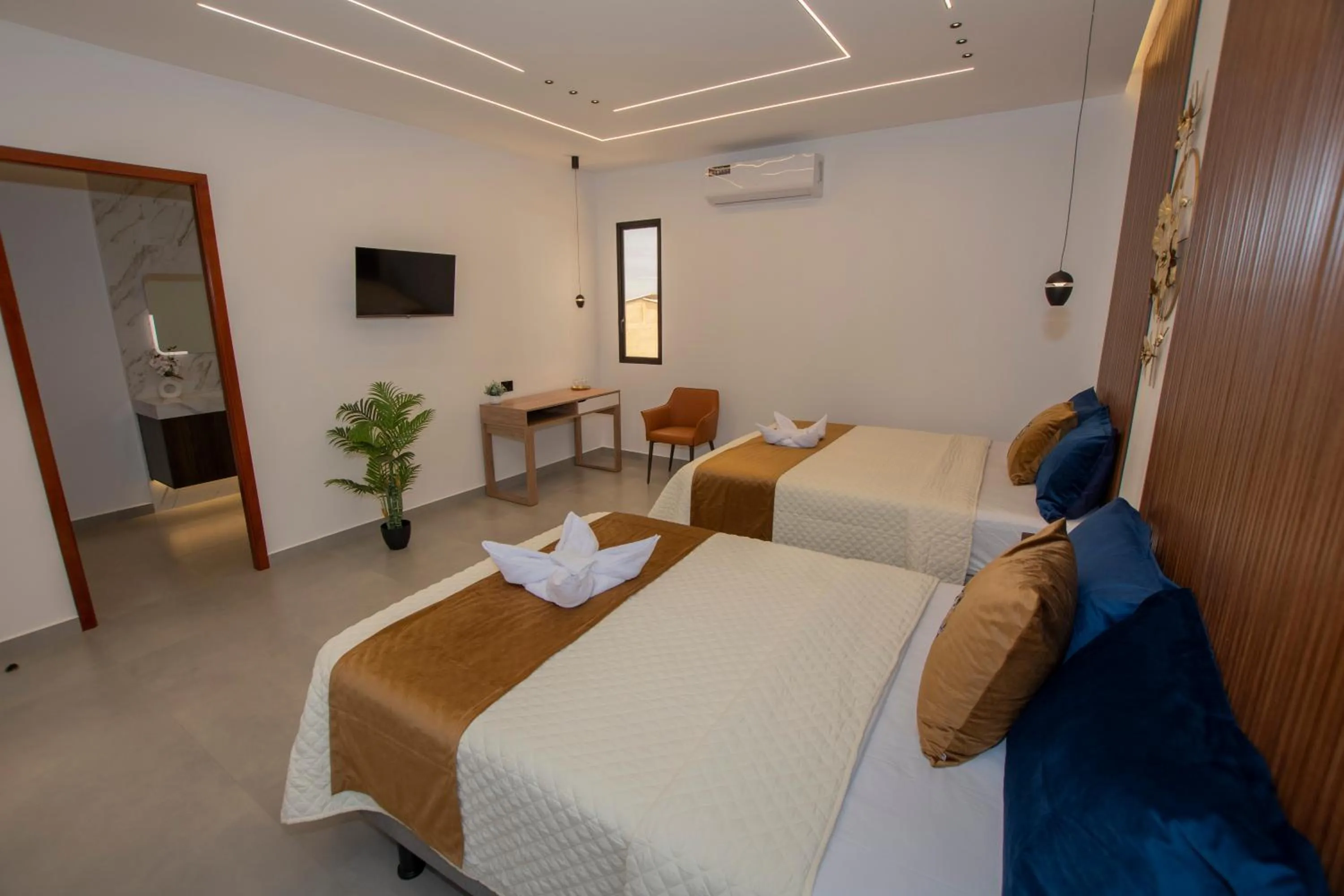 Bed in Blue Marlin Galápagos, Hotel & SPA