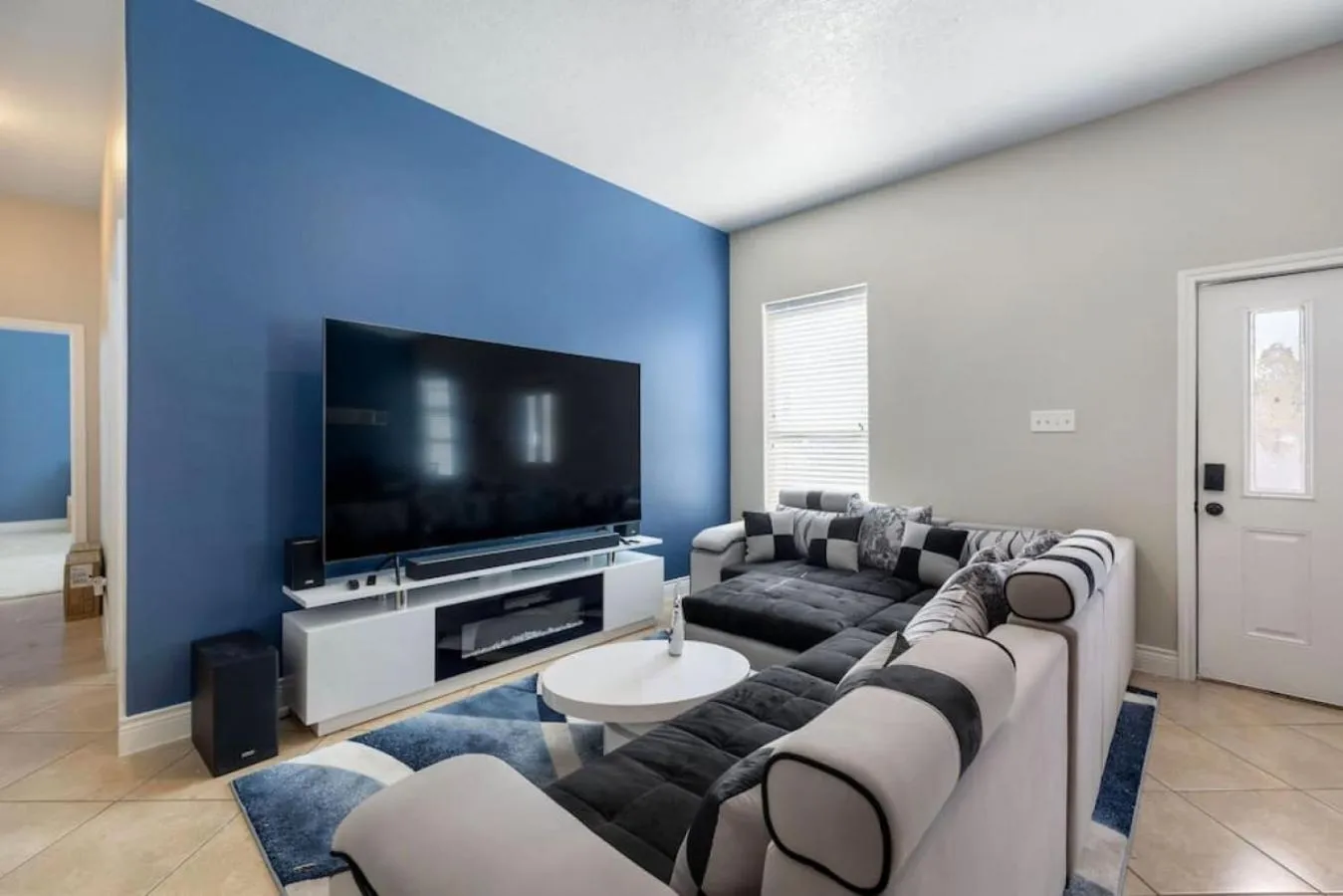 Living room in Stylish 3 Bedroom With Tons of Games and 85 Inch TV