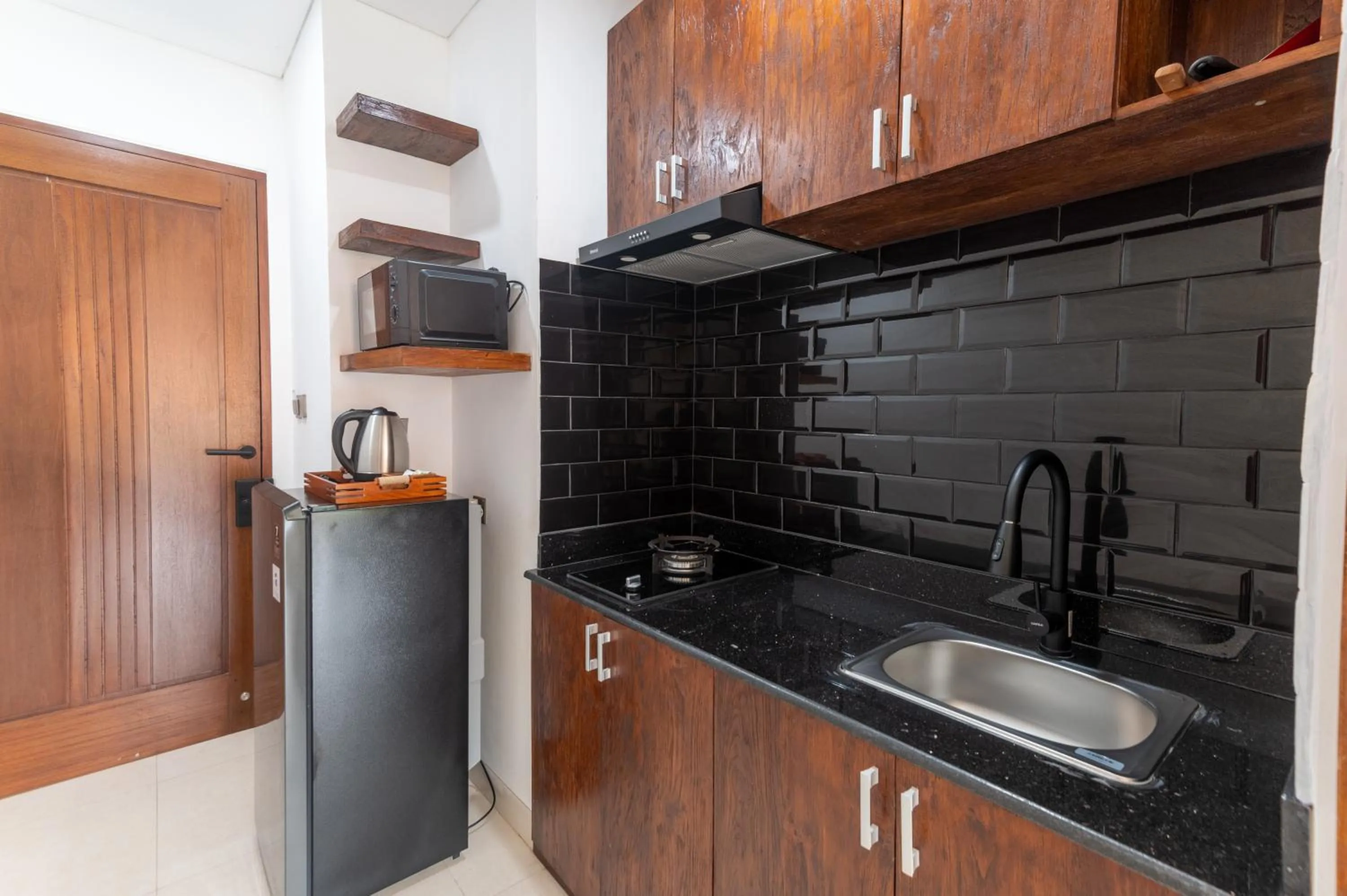 Kitchen or kitchenette in Griya Shanti Suites