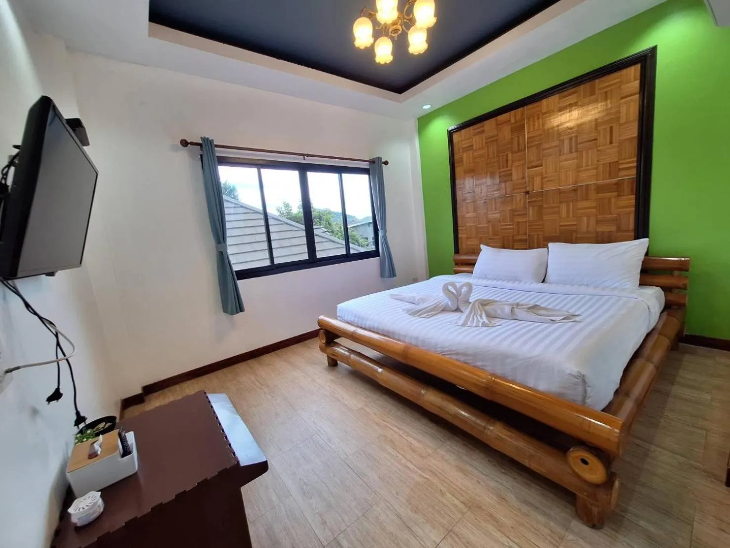 Bed in Kan Home Hotel