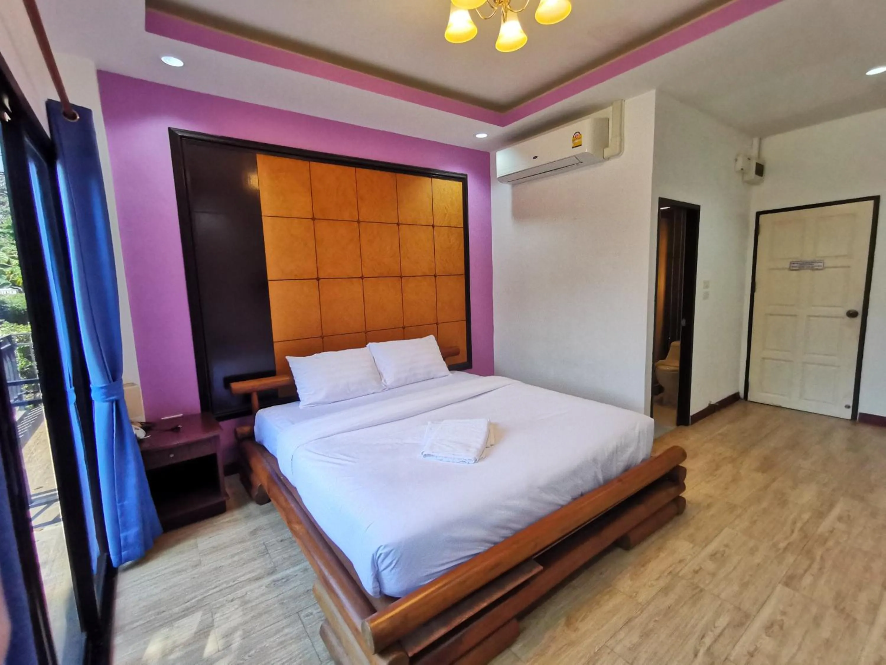 Bed in Kan Home Hotel