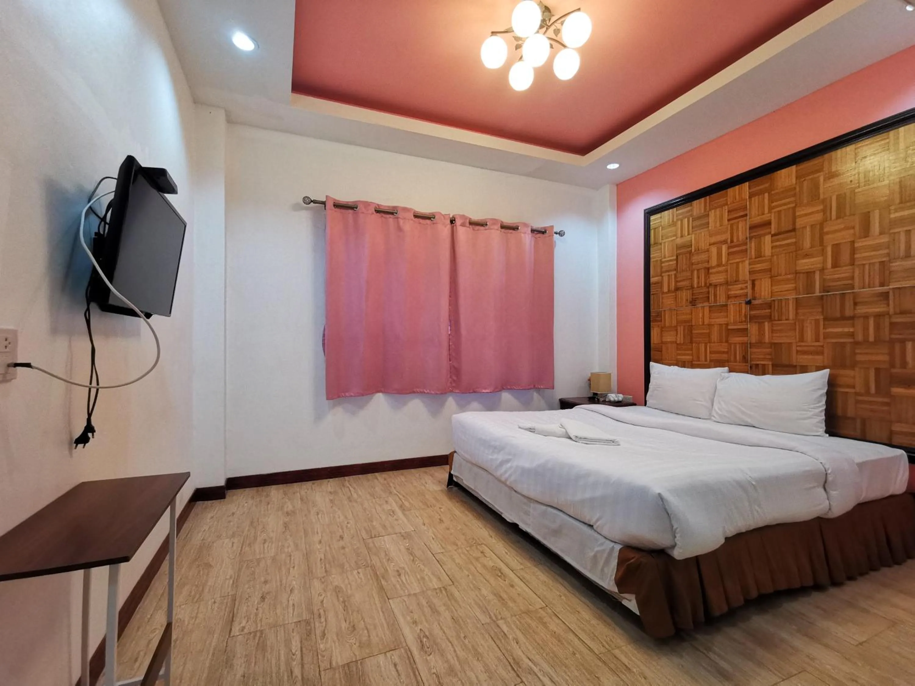 Bed in Kan Home Hotel