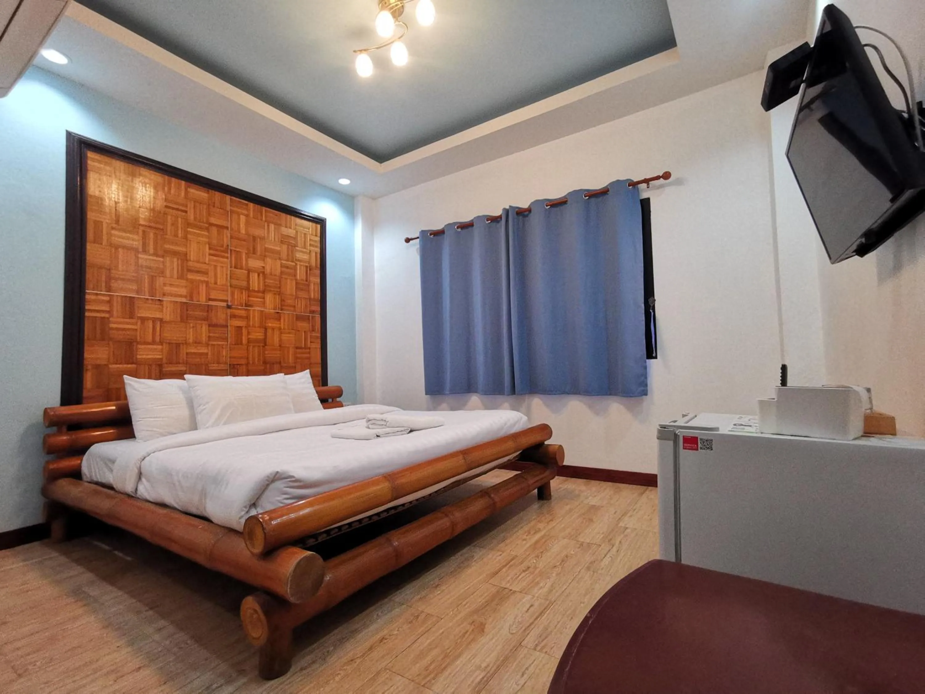 Bed in Kan Home Hotel