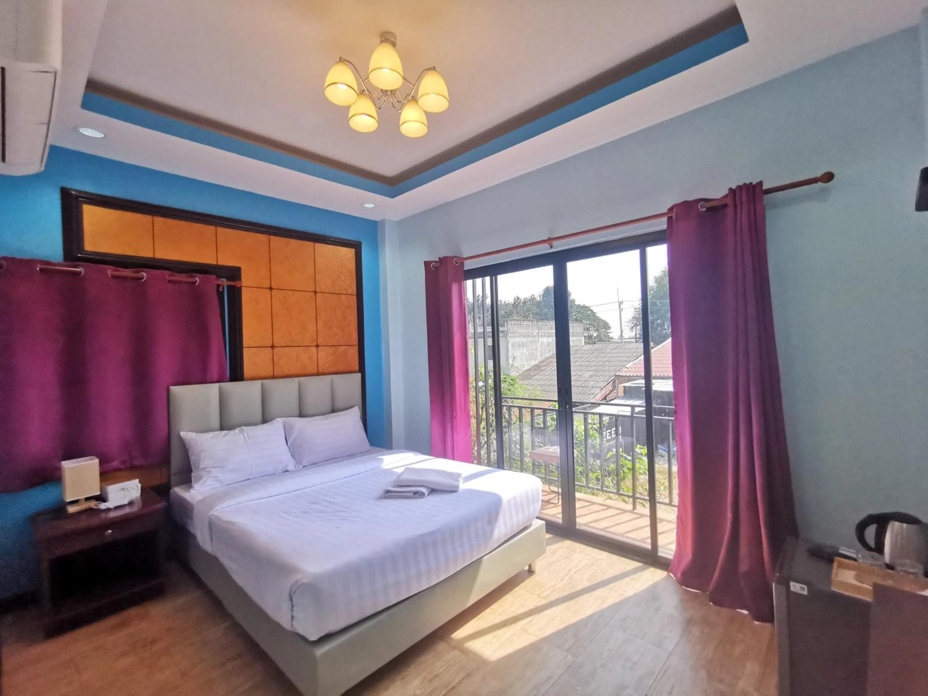 Bed in Kan Home Hotel