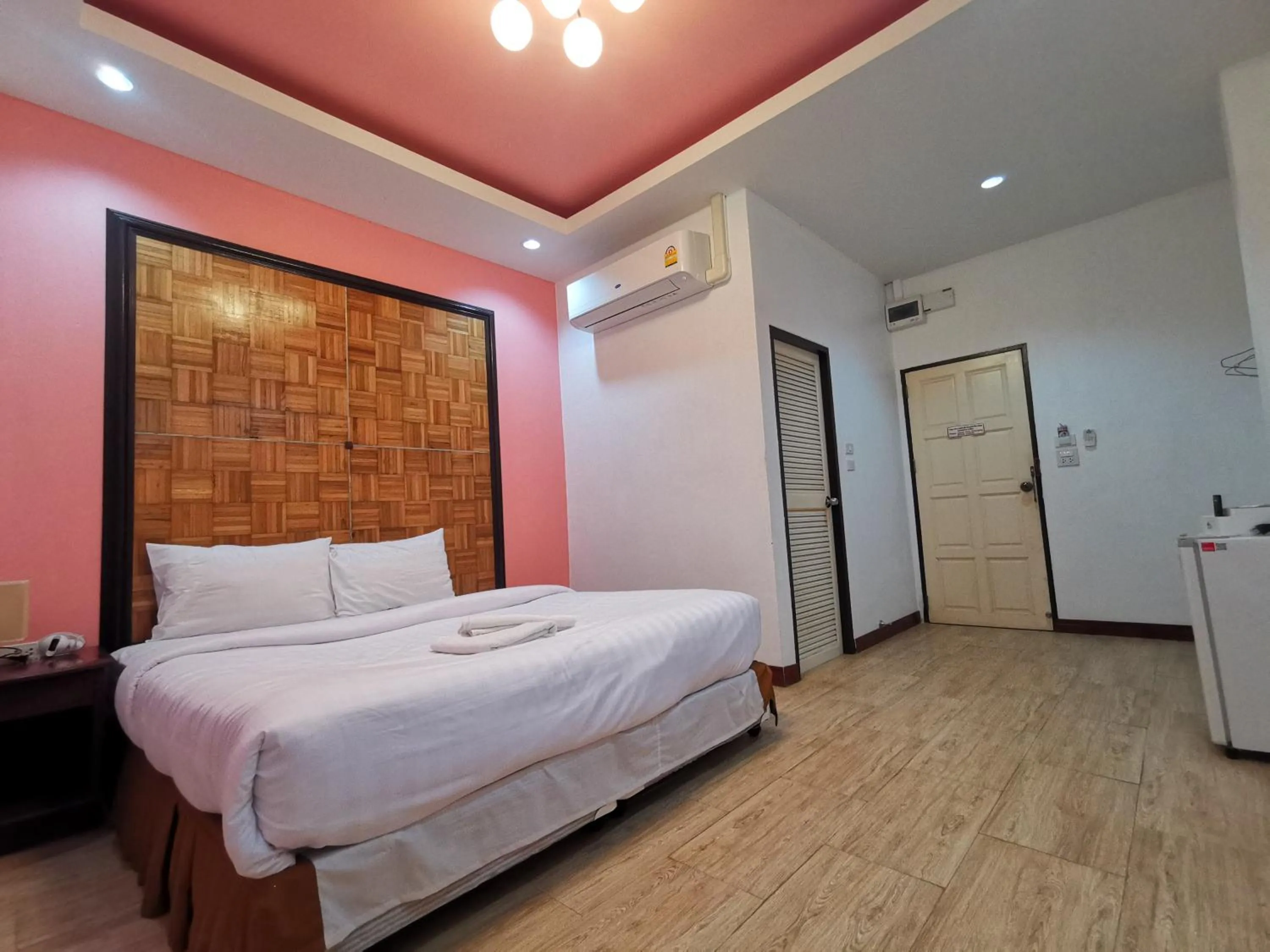 Bed in Kan Home Hotel