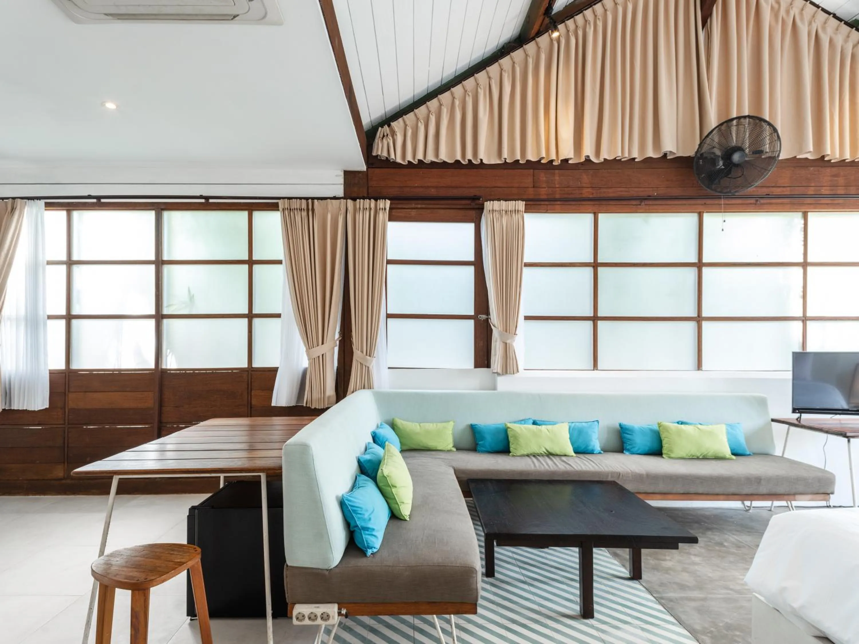 Seating area, Bed in Batu Belig Living by CPM Bali