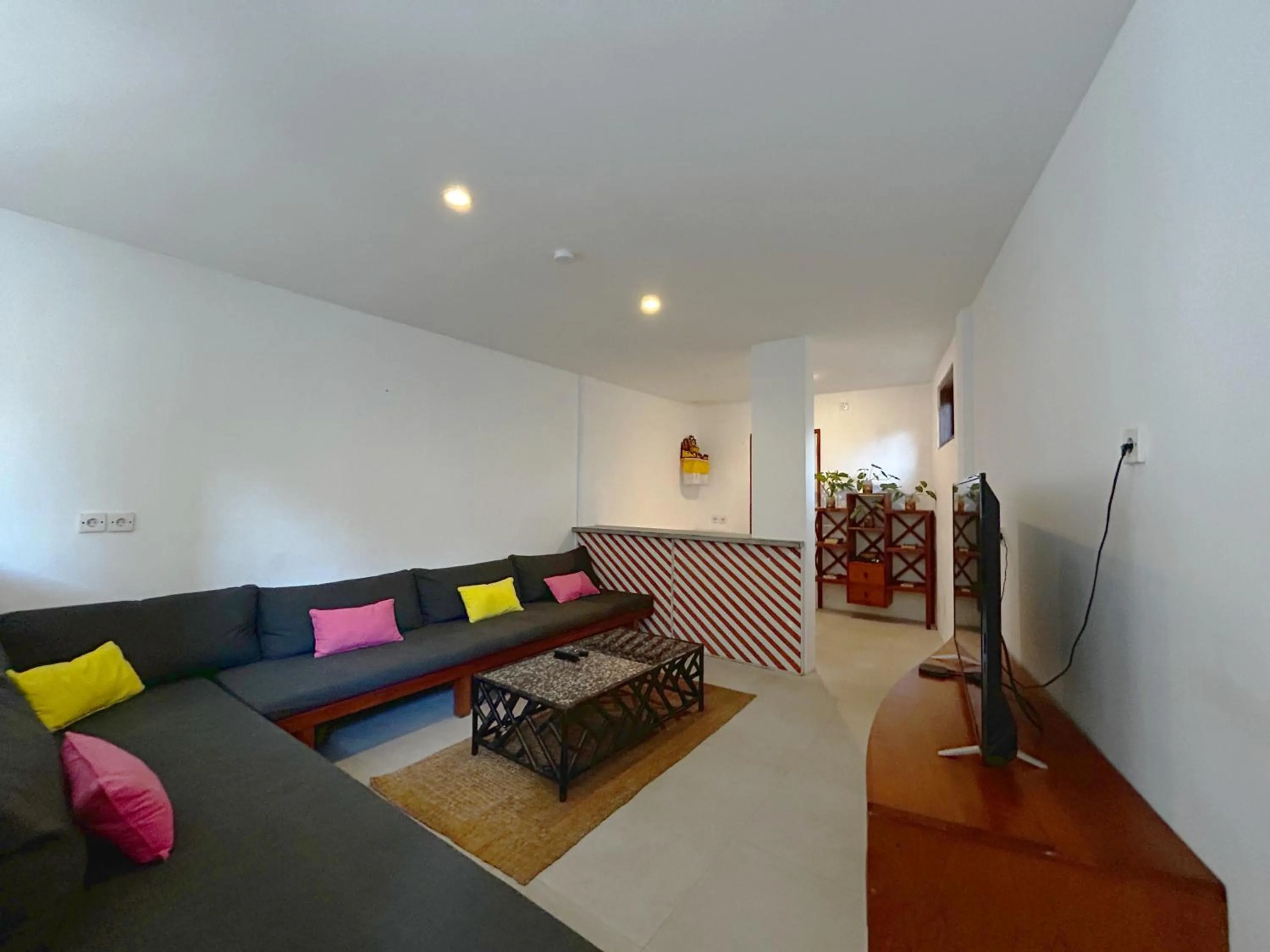 Communal lounge/ TV room in Batu Belig Living by CPM Bali