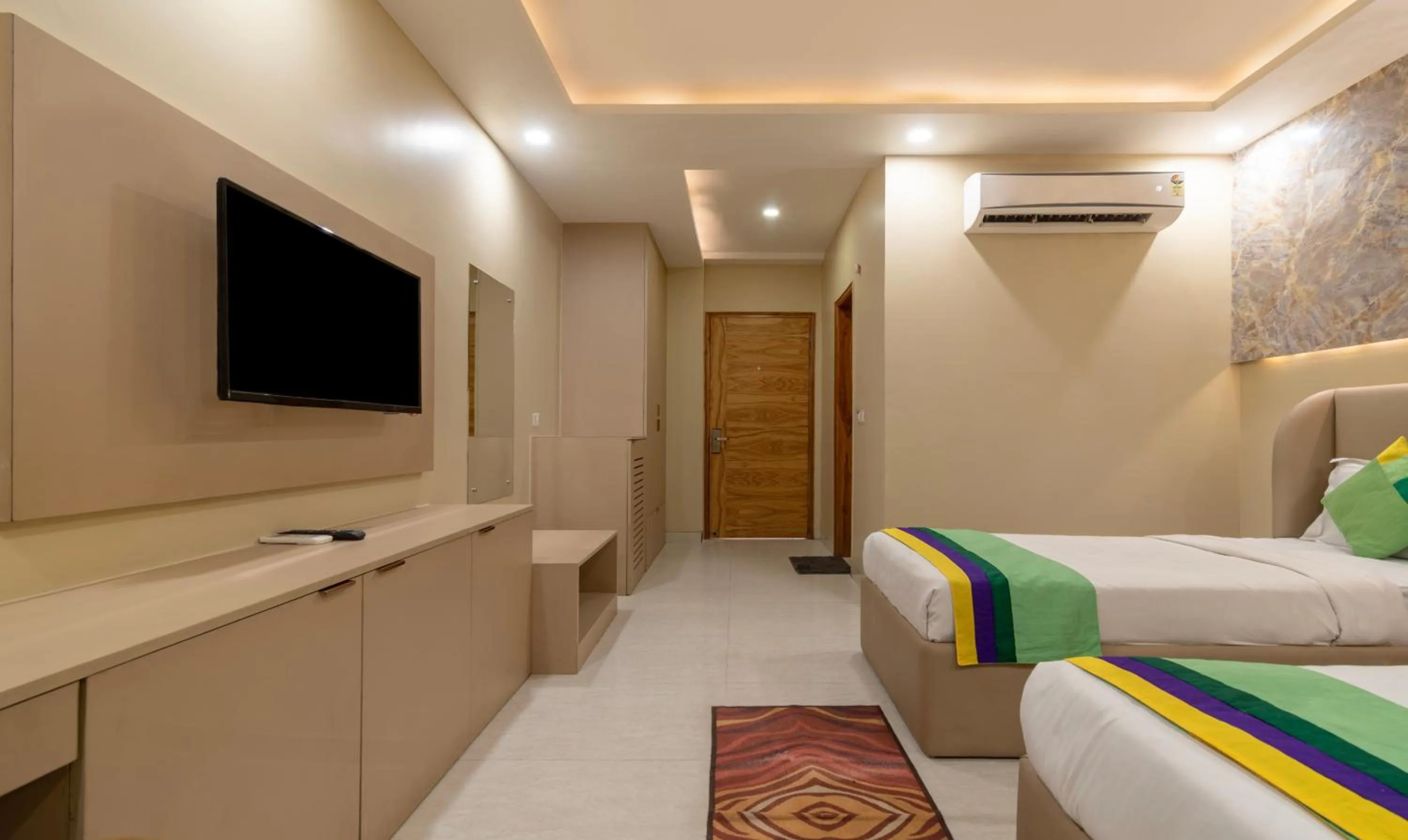 Bed, TV/Entertainment Center in Treebo Trend Mr J - Sec 51