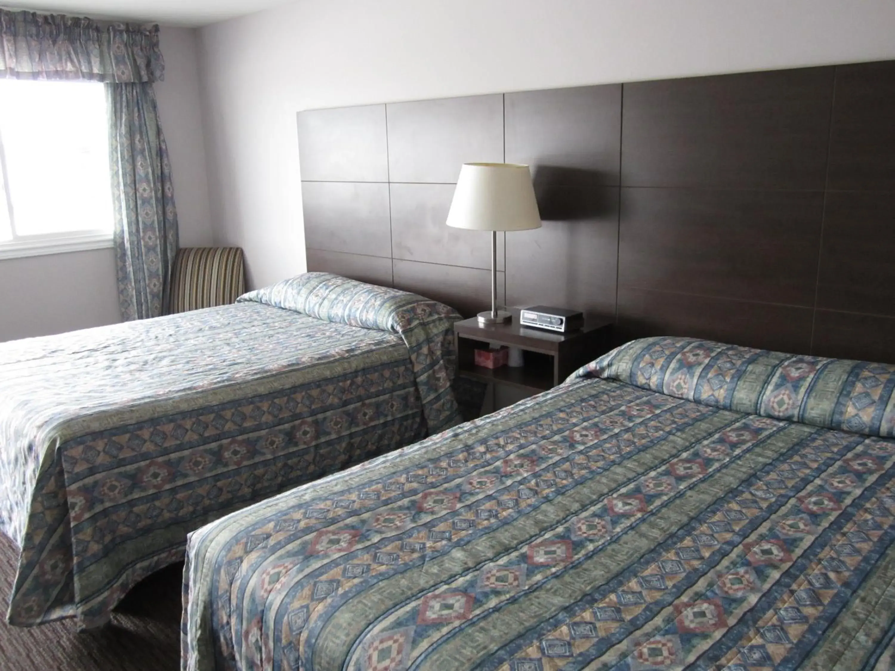 Queen Room with Two Queen Beds in Winsome Inn Queen Room with Two Queen Beds in Winsome Inn