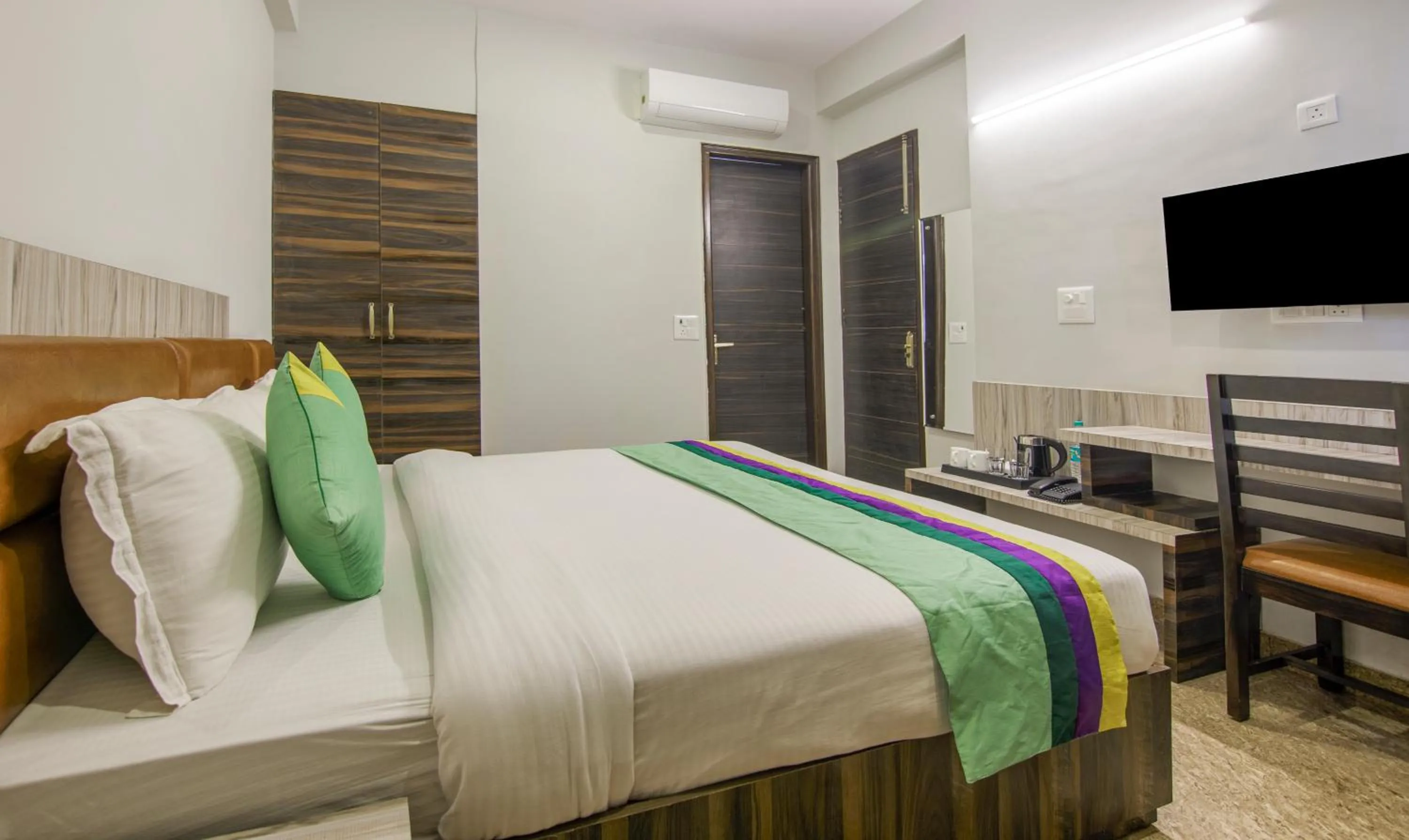 Bed in Treebo Swastika Premium