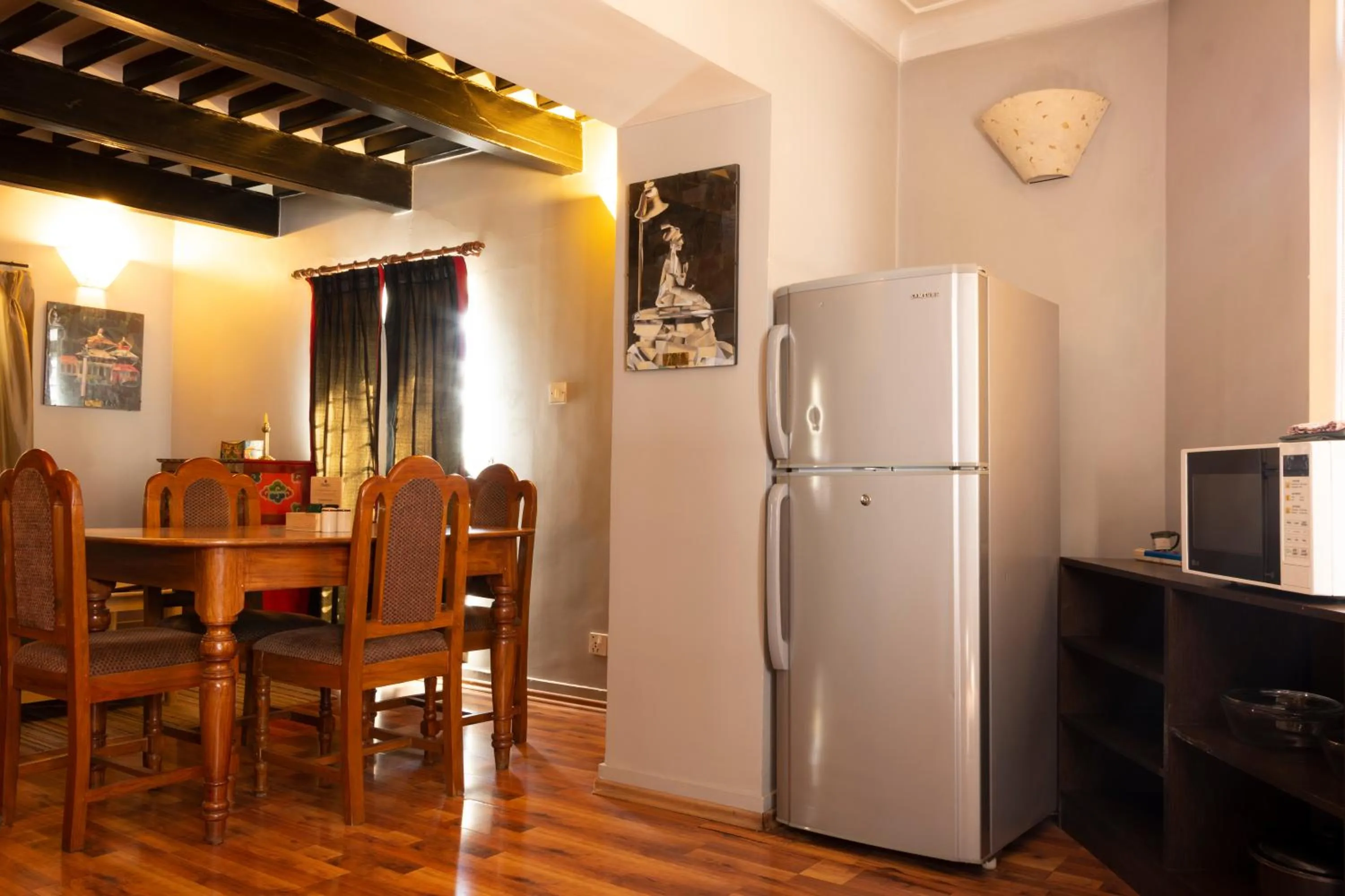 Kitchen or kitchenette in Shaligram Hotel