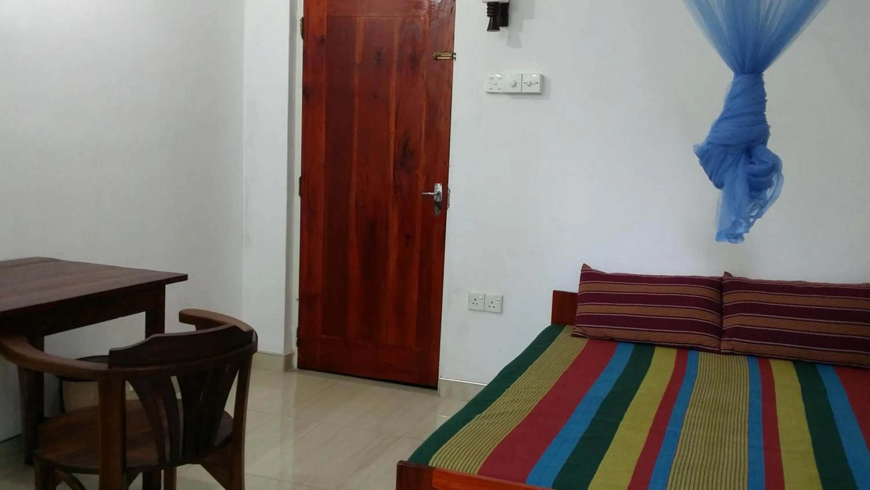 Bed in Polhena Coral Reef Resort