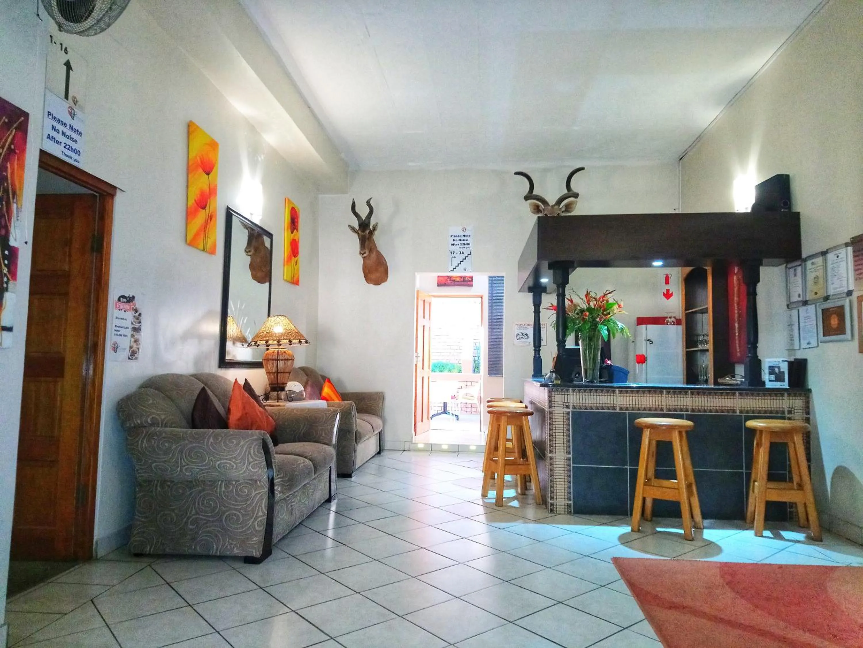 Communal lounge/ TV room in St Lucia Lodge