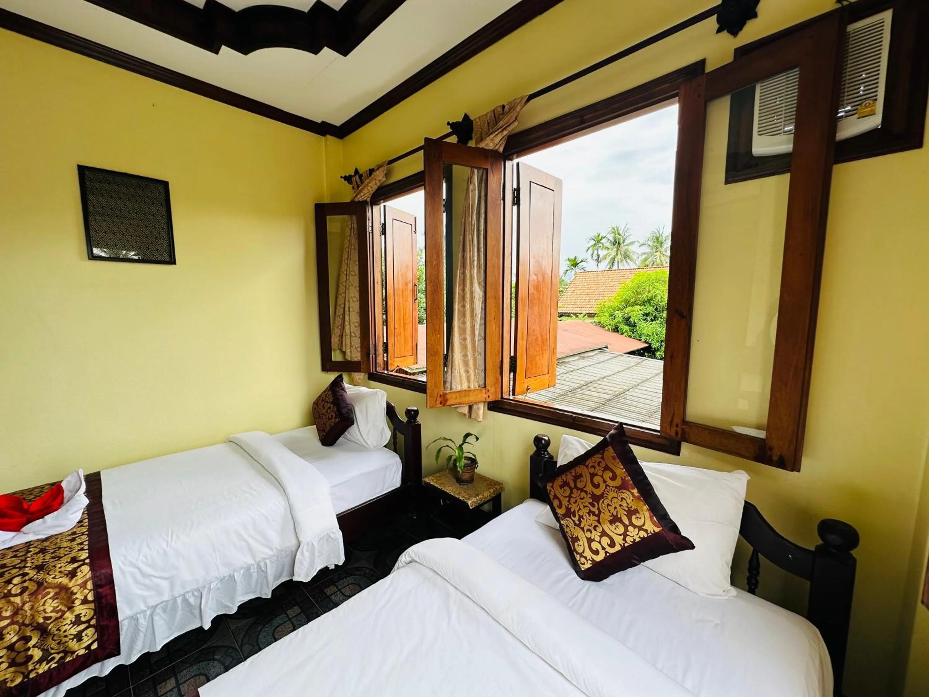 Communal lounge/ TV room, Bed in Visoun Luang Prabang Hotel