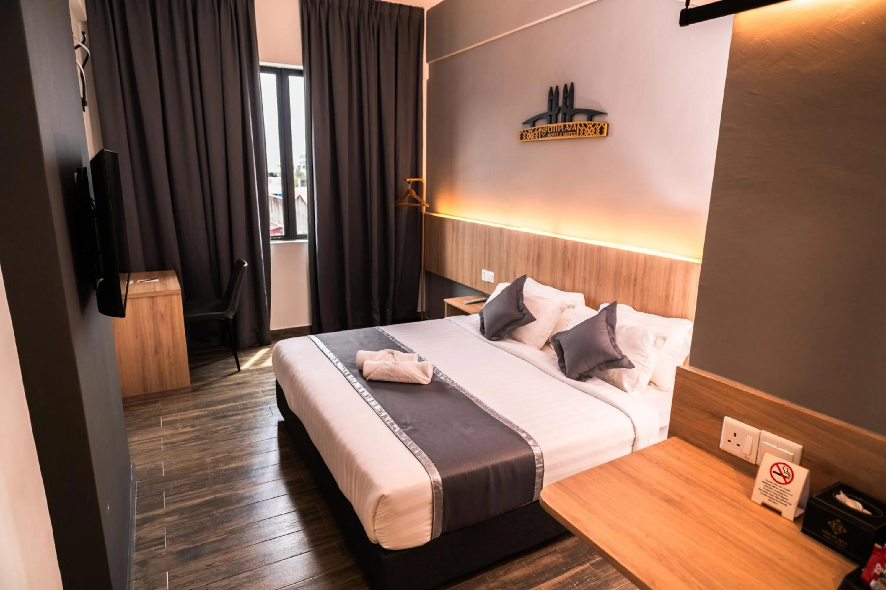 Bed in DJ Citi Plaza Hotel & Suites