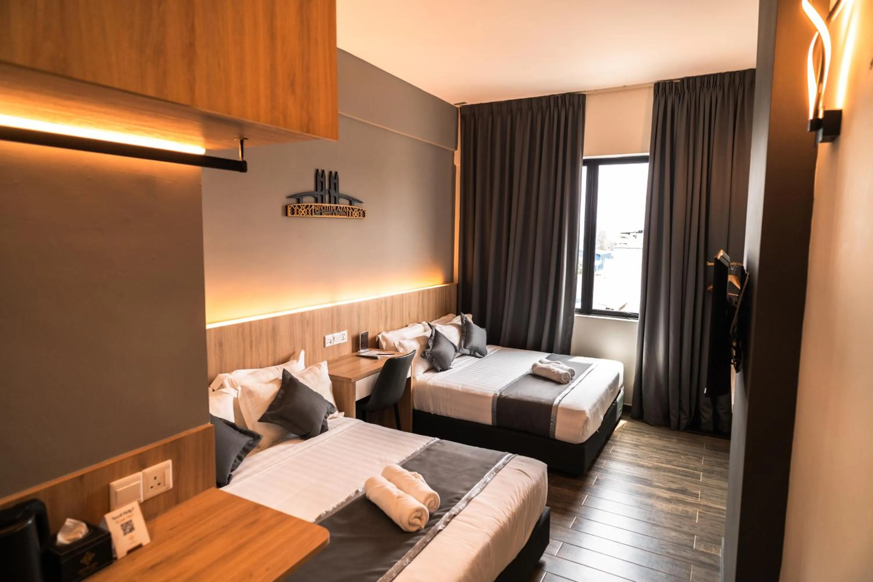 Bed in DJ Citi Plaza Hotel & Suites