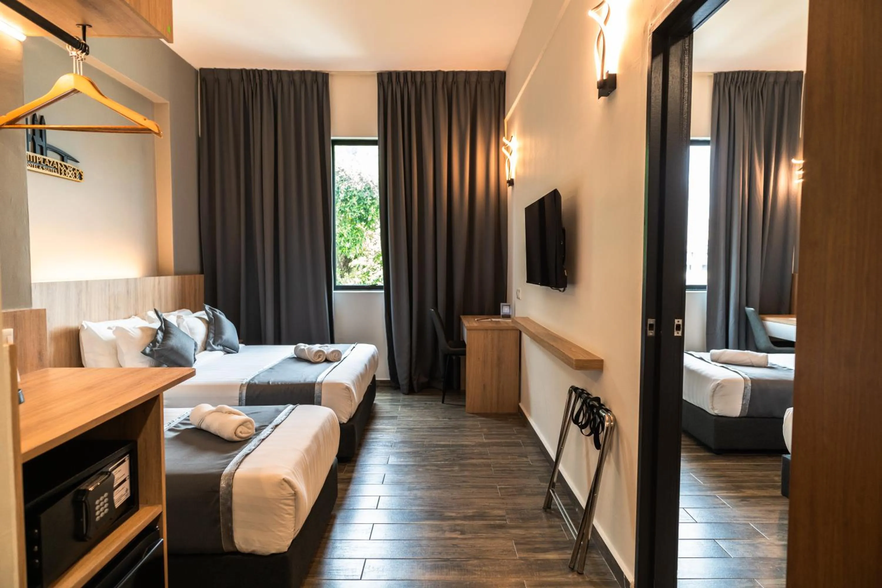 Bed in DJ Citi Plaza Hotel & Suites